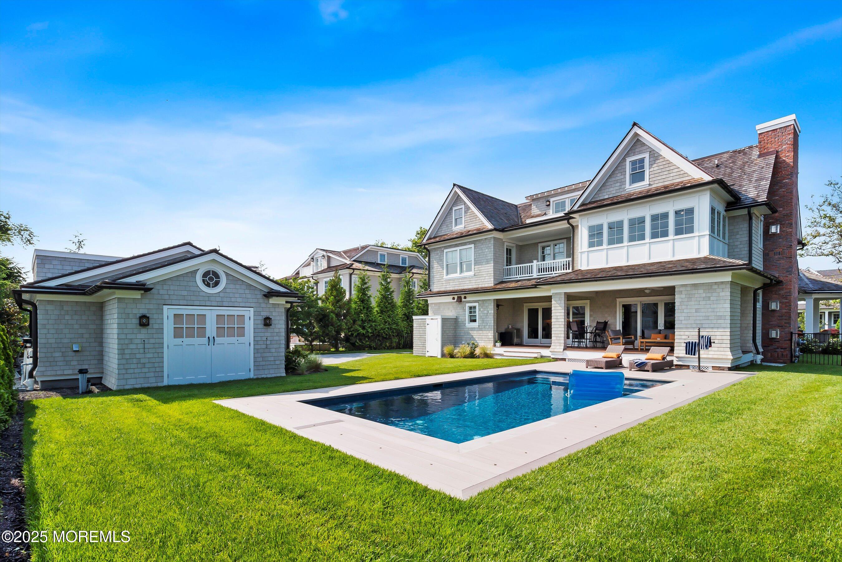205 Morris Avenue Spring Lake, NJ 07762 - Photo 7 of 105 a view of a house with pool and chairs