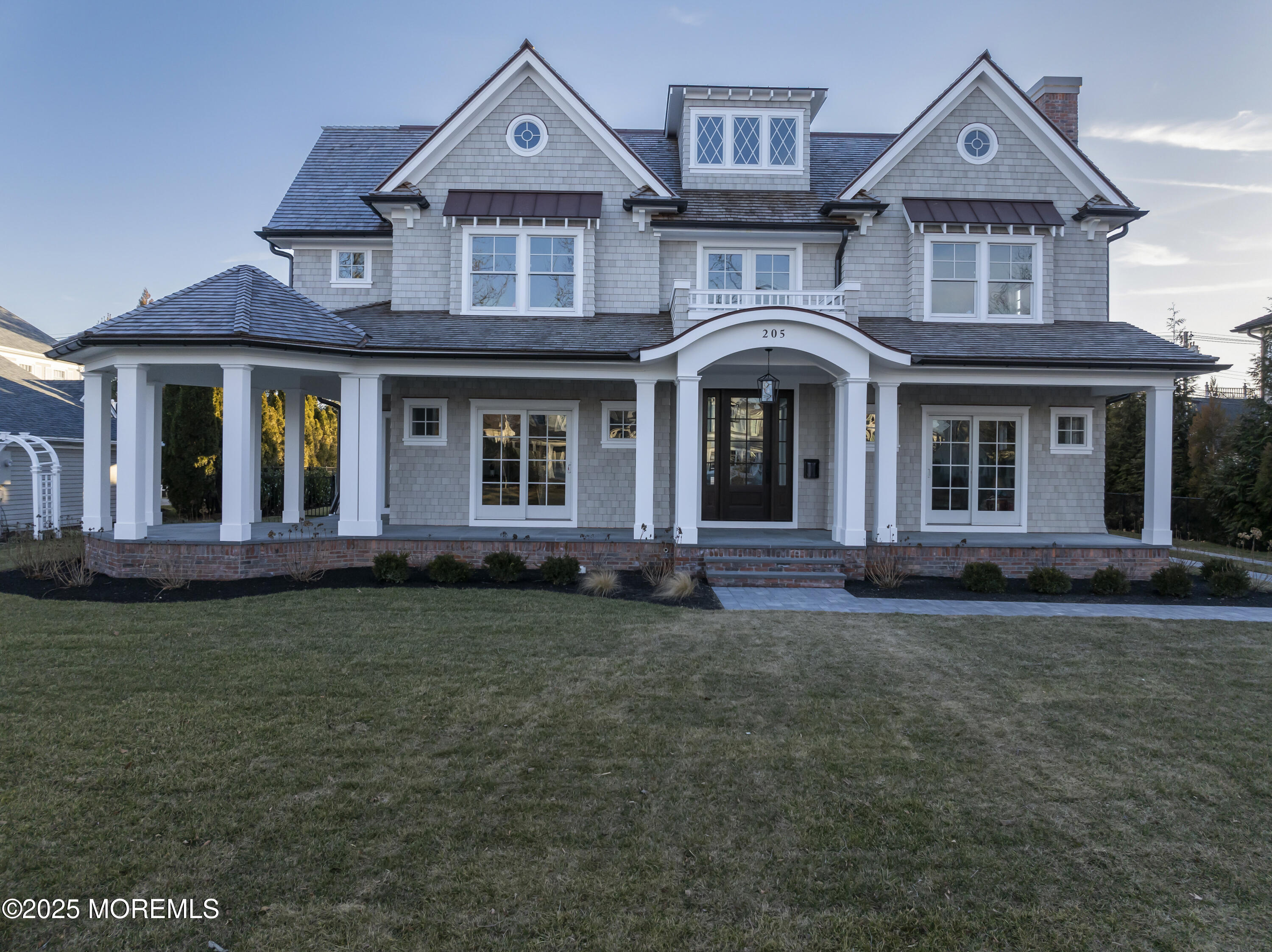 205 Morris Avenue Spring Lake, NJ 07762 - Photo 72 of 105 a front view of a house with garden