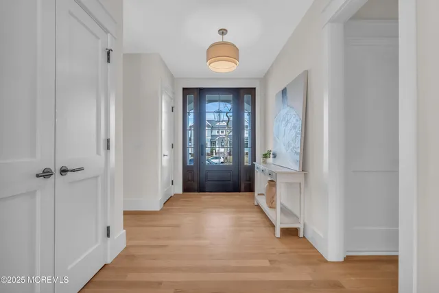 a work room with furniture and a wooden floor