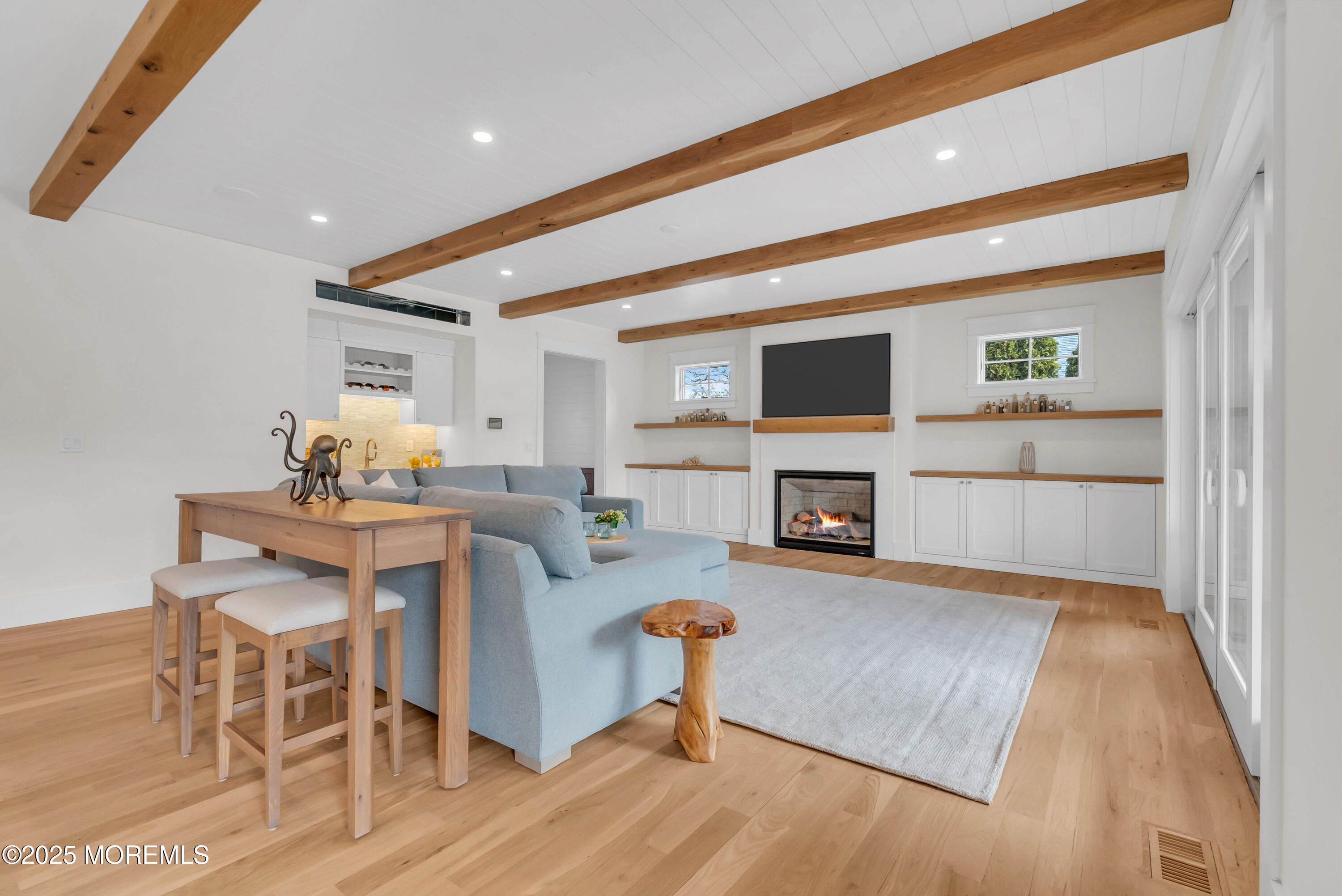 205 Morris Avenue Spring Lake, NJ 07762 - Photo 92 of 105 a living room with furniture and a fireplace