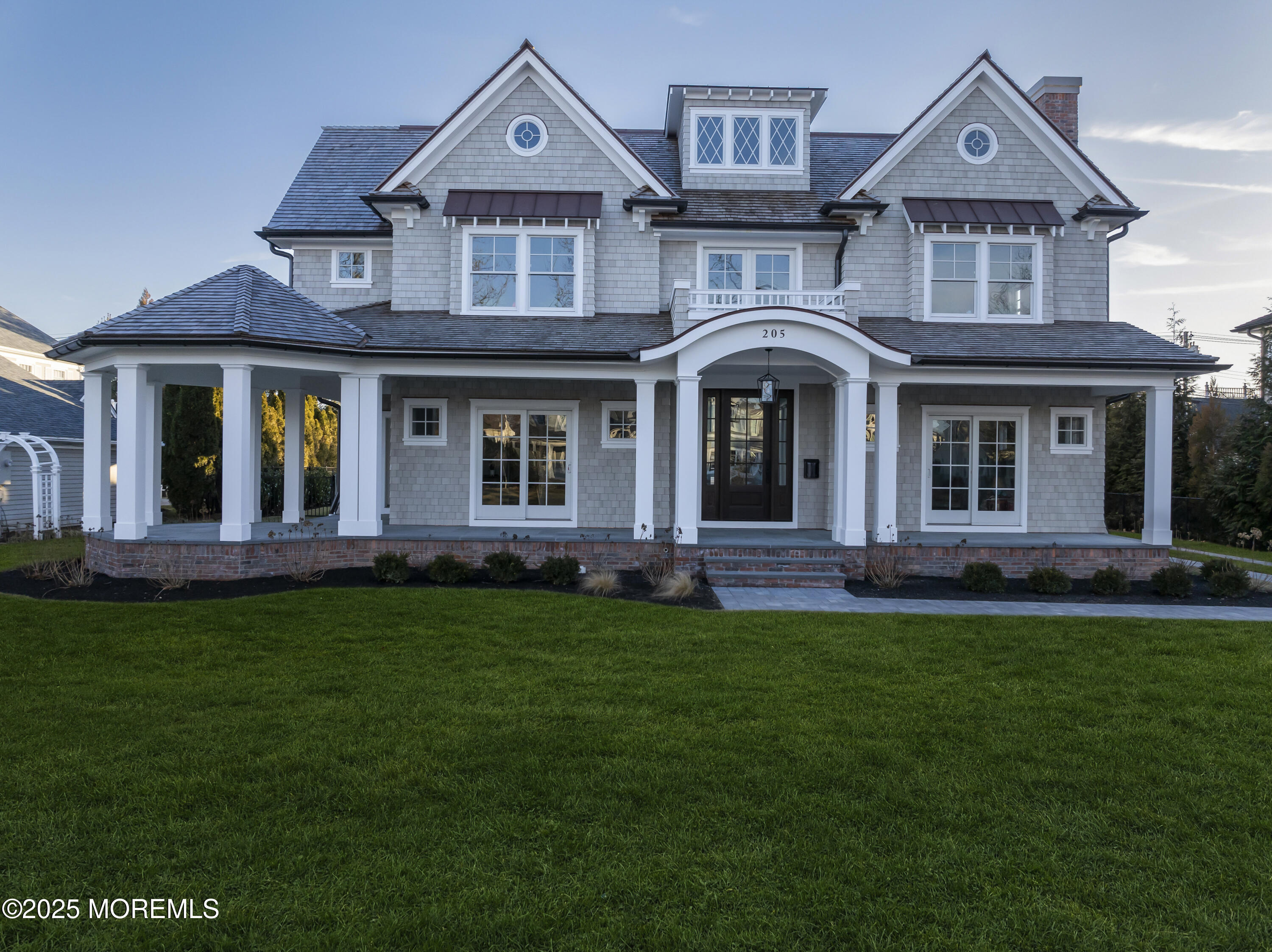 205 Morris Avenue Spring Lake, NJ 07762 - Photo 100 of 105 a front view of a house with a garden