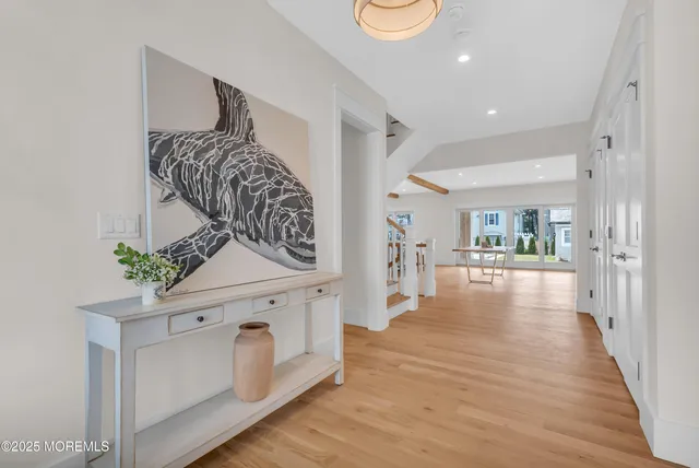 a bathroom with a sink mirror and toilet