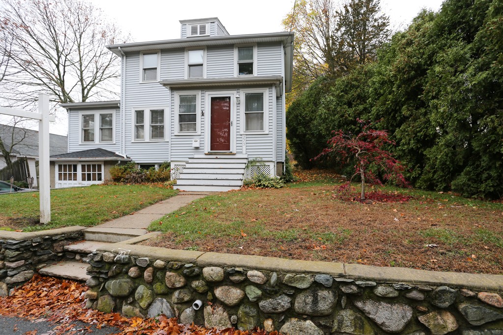 275 Broad Meadow Road Needham, MA 02492 - Photo 1 of 26 a front view of a house with a yard