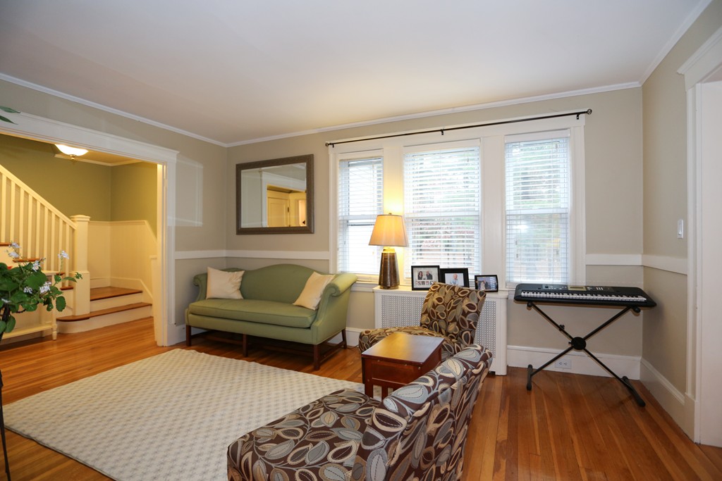 275 Broad Meadow Road Needham, MA 02492 - Photo 5 of 26 a living room with furniture and a wooden floor