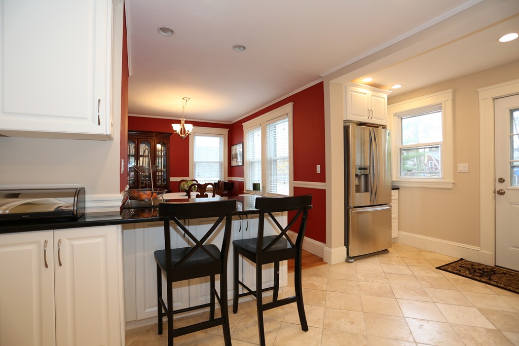 275 Broad Meadow Road Needham, MA 02492 - Photo 9 of 26 a view of a dining room with furniture and a window