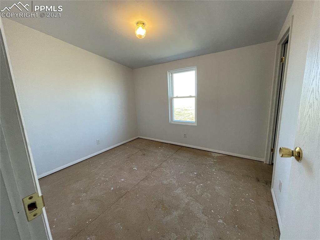7540 Boone Road Yoder, CO 80864 - Photo 16 of 31 an empty room with windows