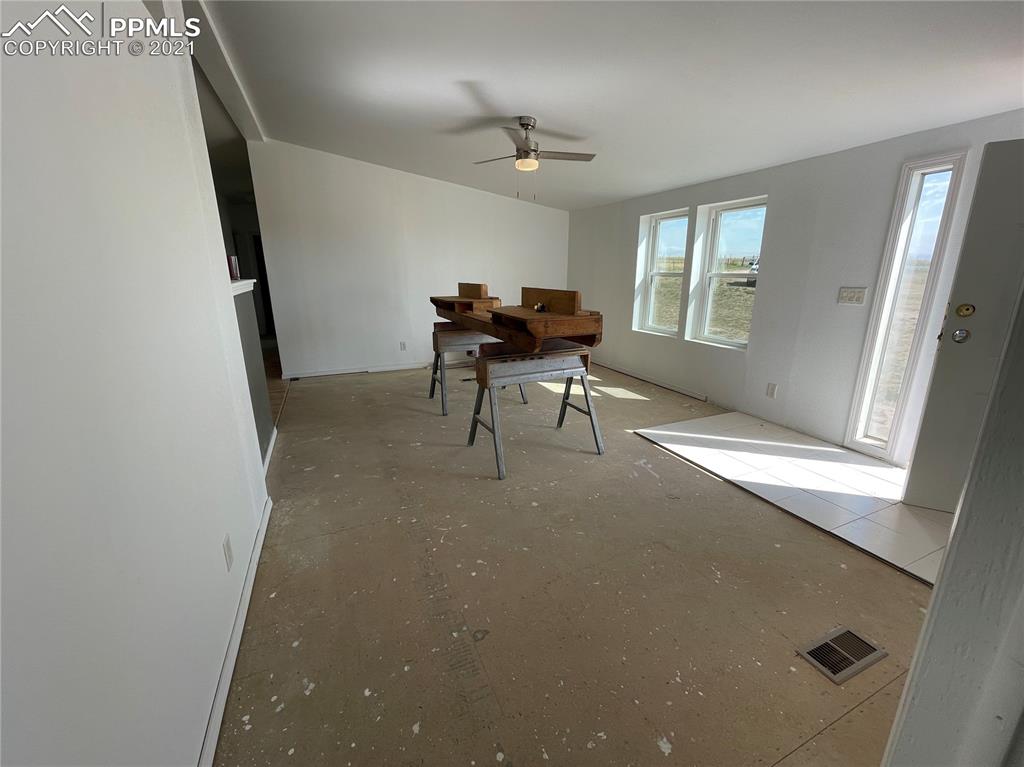 7540 Boone Road Yoder, CO 80864 - Photo 20 of 31 a living room with furniture and a window
