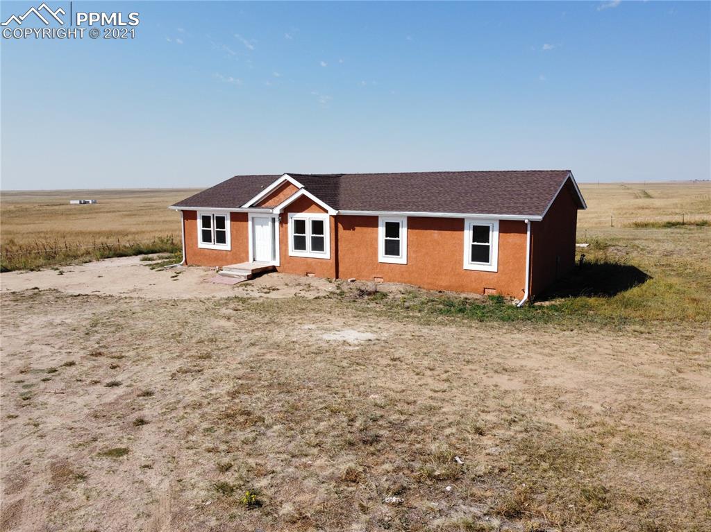 7540 Boone Road Yoder, CO 80864 - Photo 28 of 31 a front view of house with yard