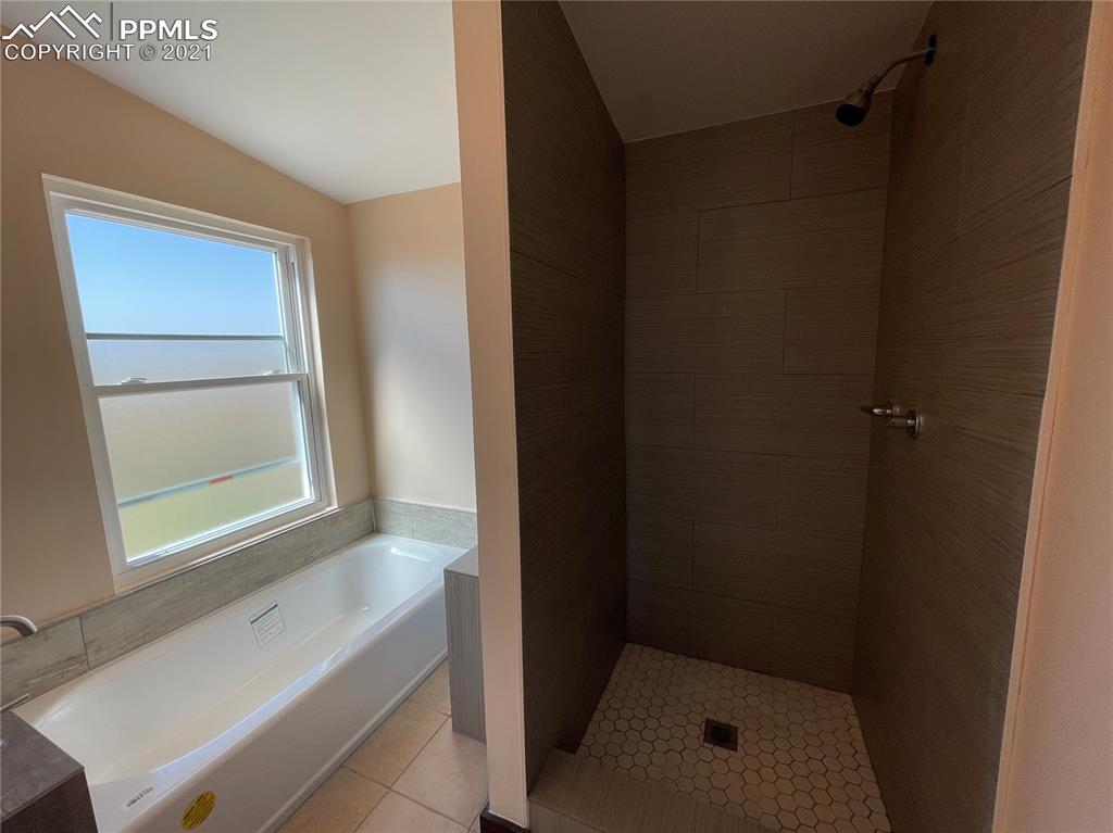7540 Boone Road Yoder, CO 80864 - Photo 6 of 31 a bathroom with a bathtub and shower
