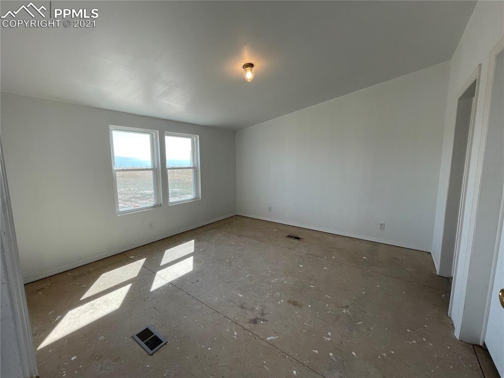 7540 Boone Road Yoder, CO 80864 - Photo 8 of 31 an empty room with windows