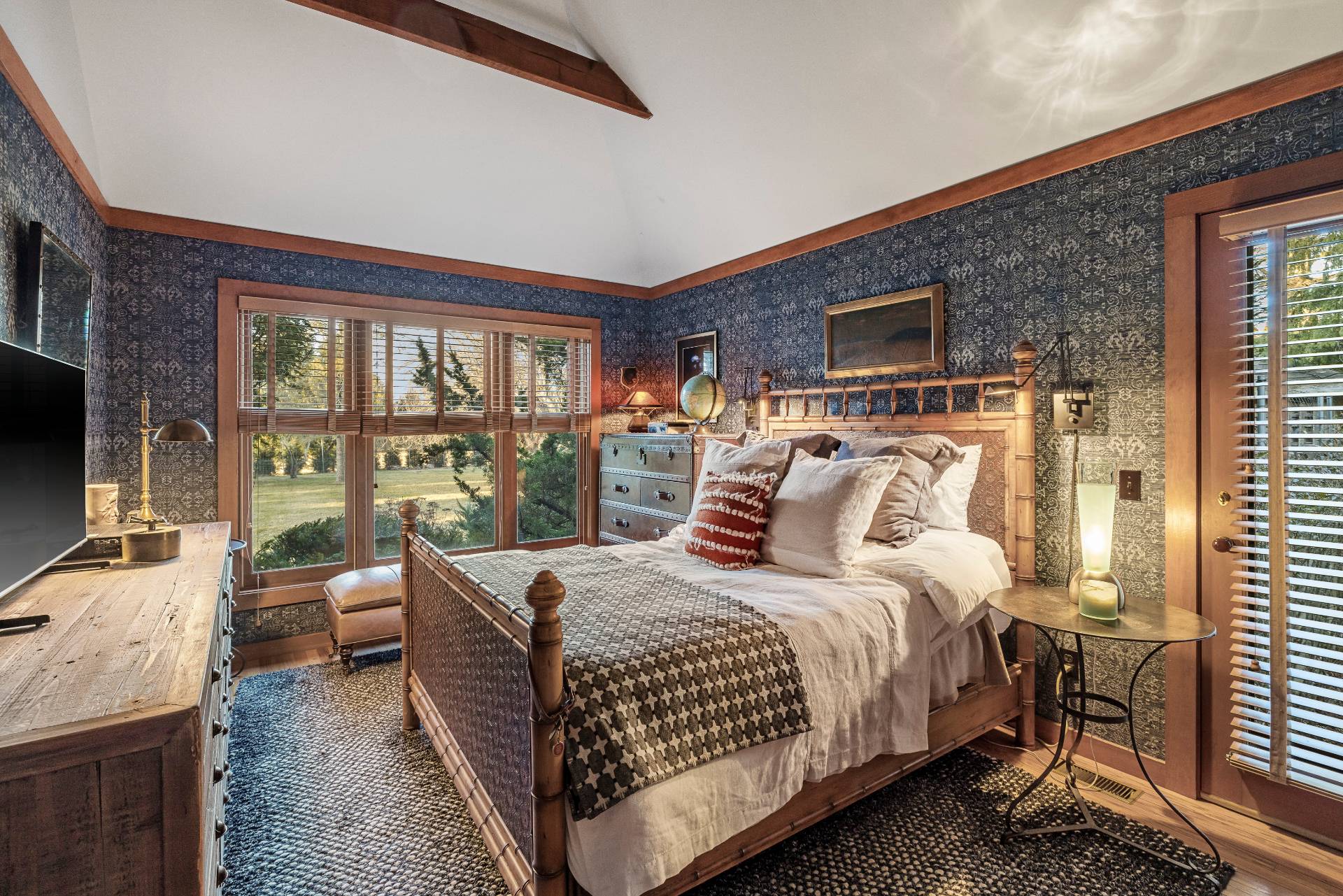 488 Lumber Lane Bridgehampton, NY 11932 - Photo 15 of 21 a bedroom with a large bed and a flat tv screen