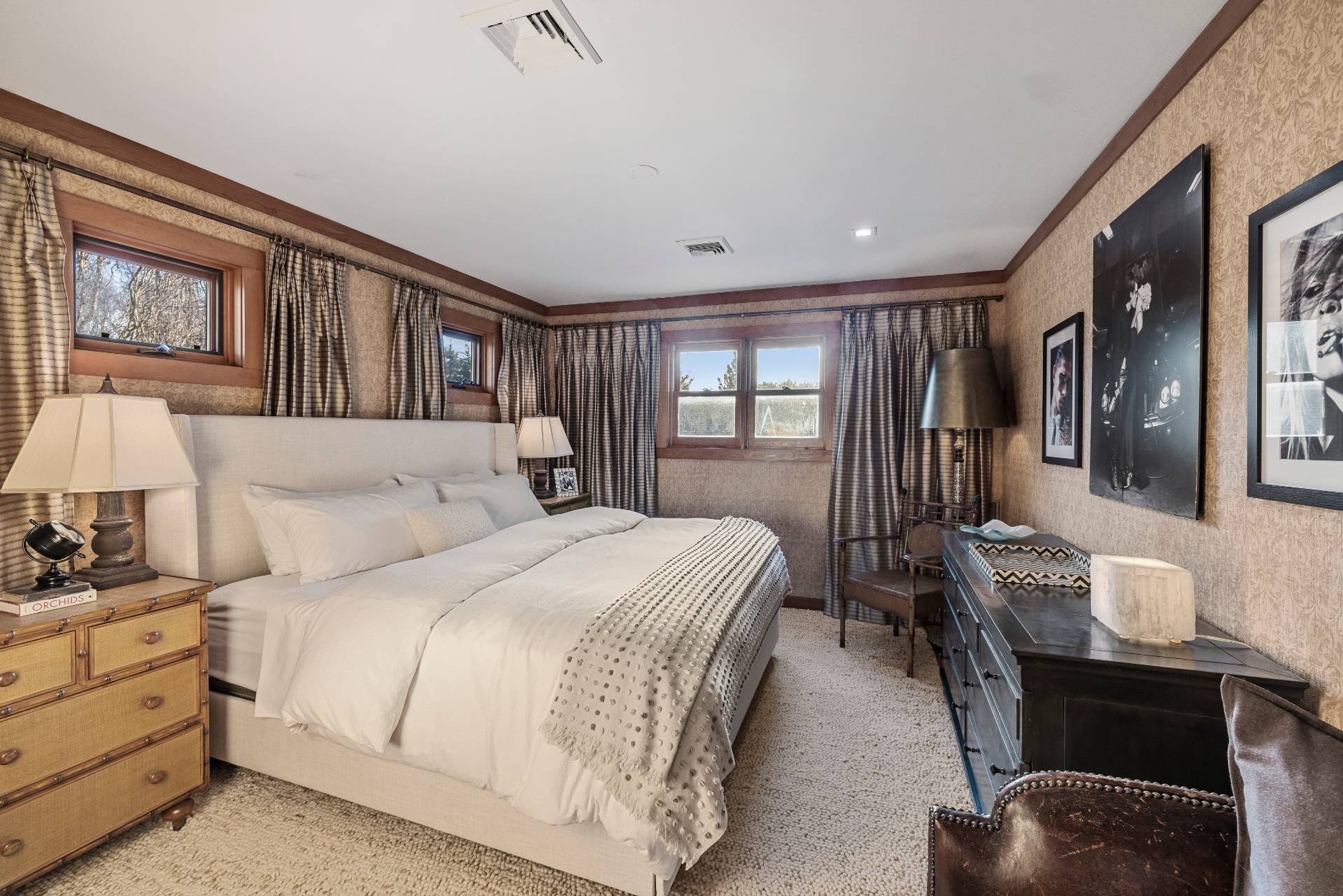 488 Lumber Lane Bridgehampton, NY 11932 - Photo 16 of 21 a bedroom with a large bed and a chandelier