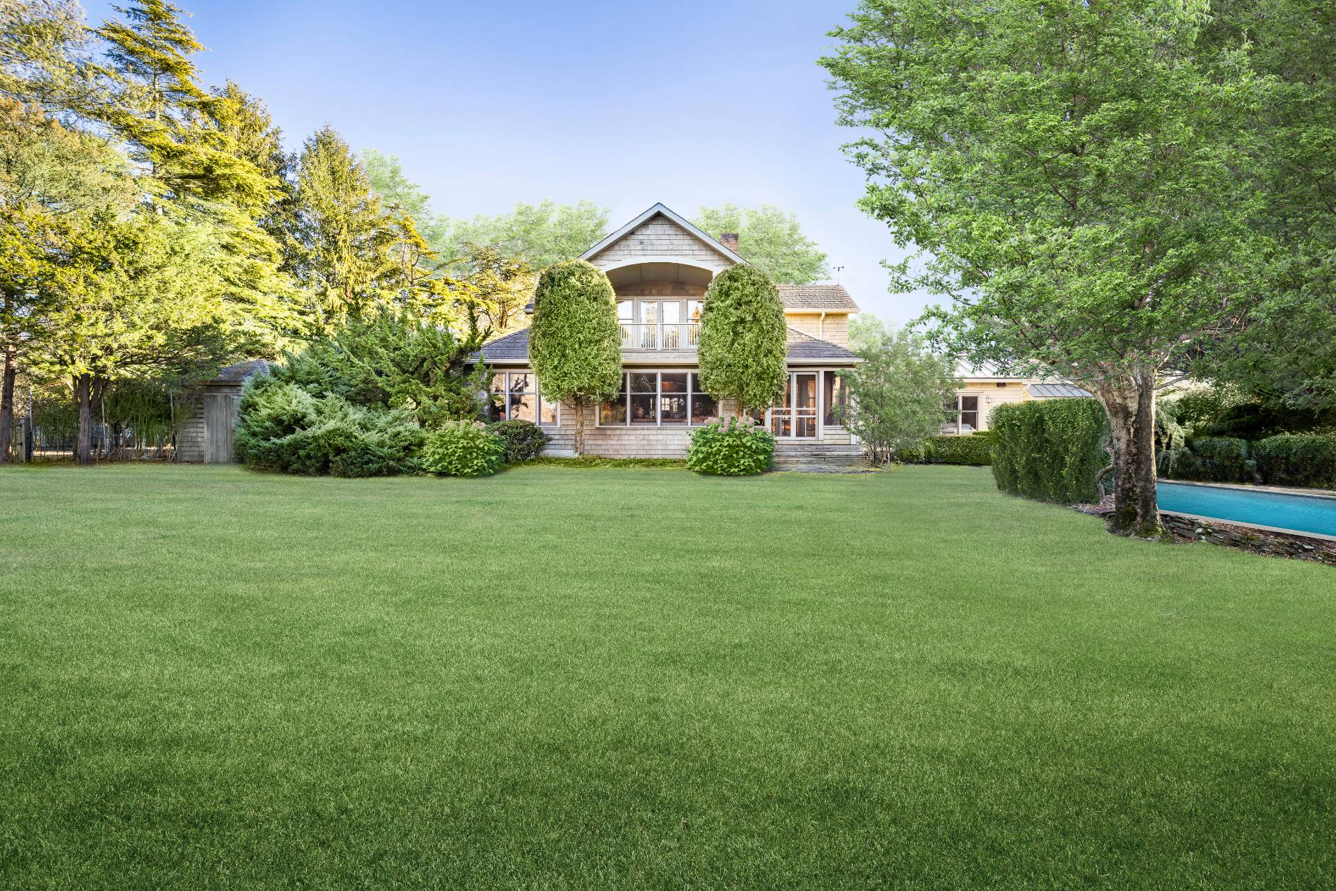 488 Lumber Lane Bridgehampton, NY 11932 - Photo 3 of 21 a view of a big house with a big yard and large trees