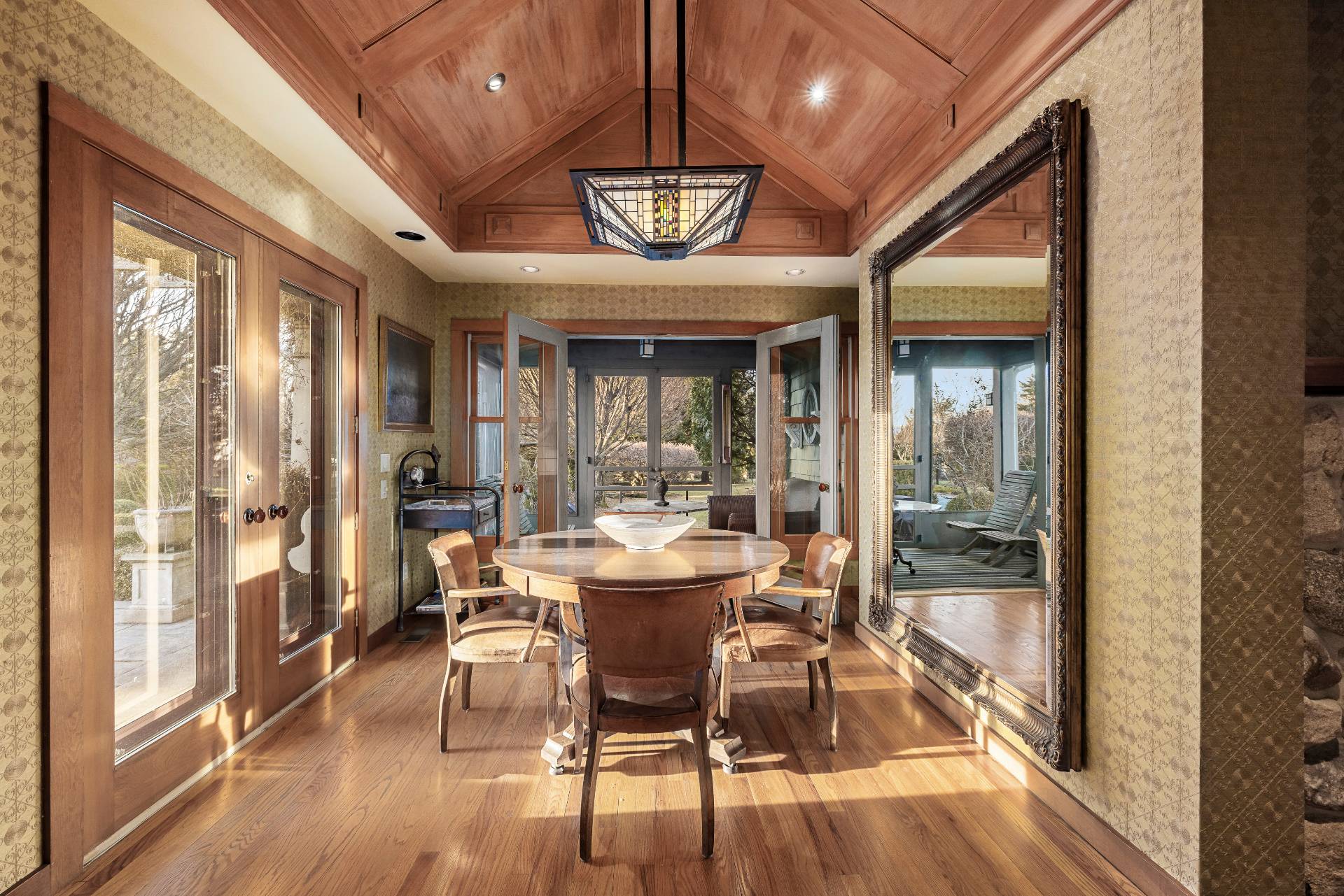 488 Lumber Lane Bridgehampton, NY 11932 - Photo 8 of 21 a view of a dining room with furniture wooden floor and a chandelier