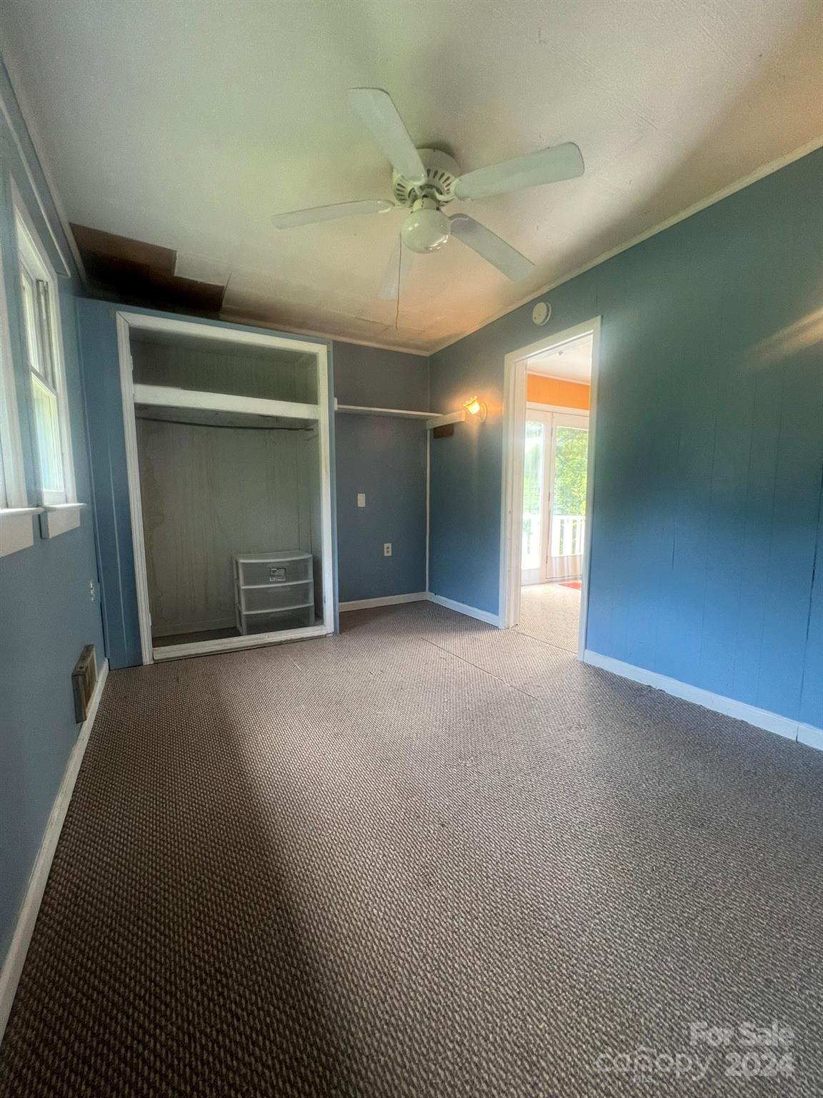 1323 Locust Grove Road Hendersonville, NC 28792 - Photo 12 of 40 an empty room with windows and closet