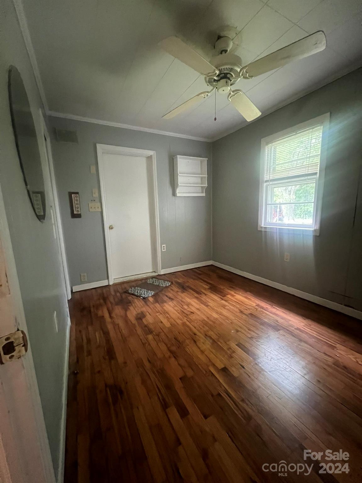 1323 Locust Grove Road Hendersonville, NC 28792 - Photo 13 of 40 a view of an empty room with a window