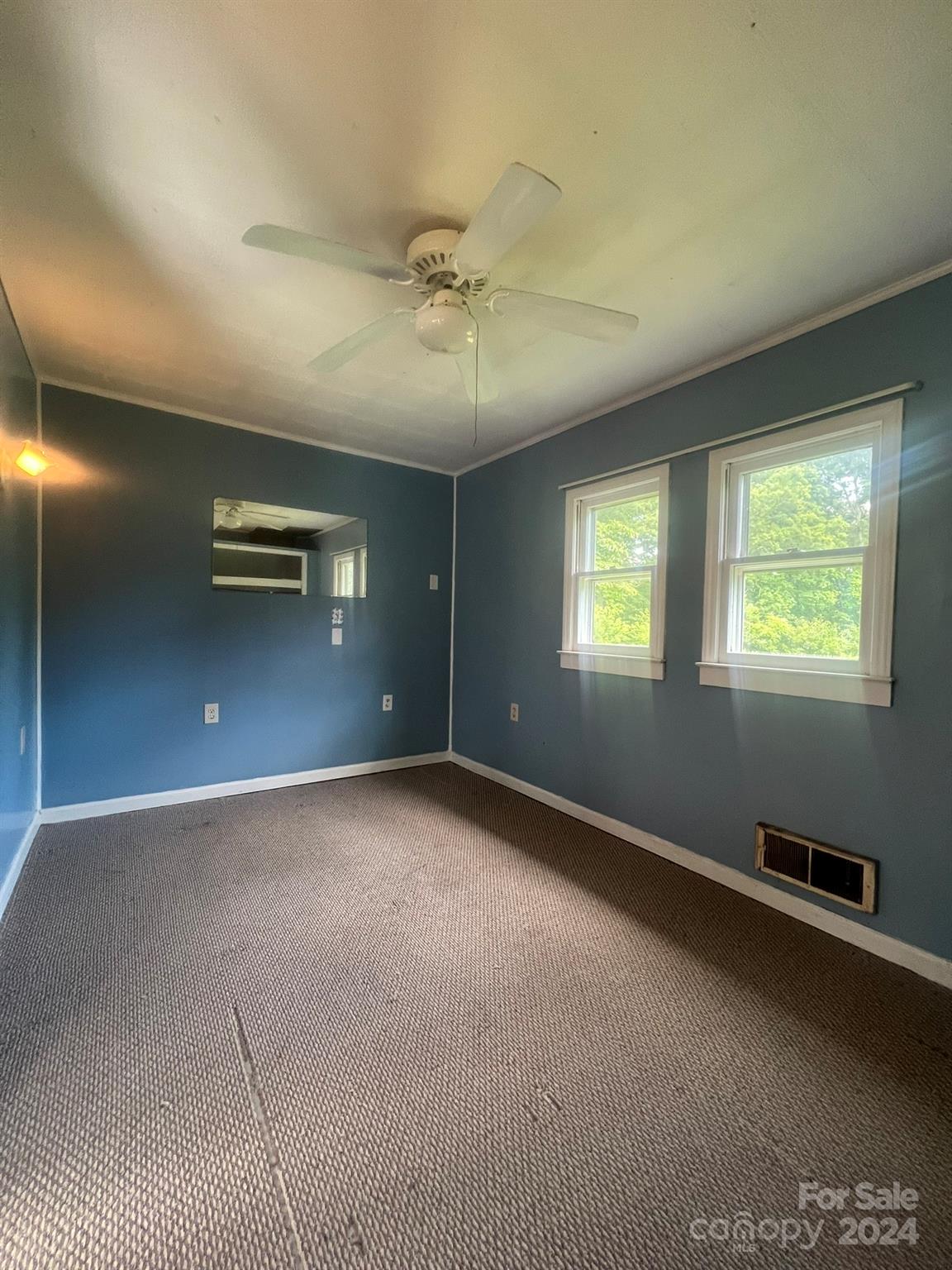 1323 Locust Grove Road Hendersonville, NC 28792 - Photo 23 of 40 a view of an empty room with a window