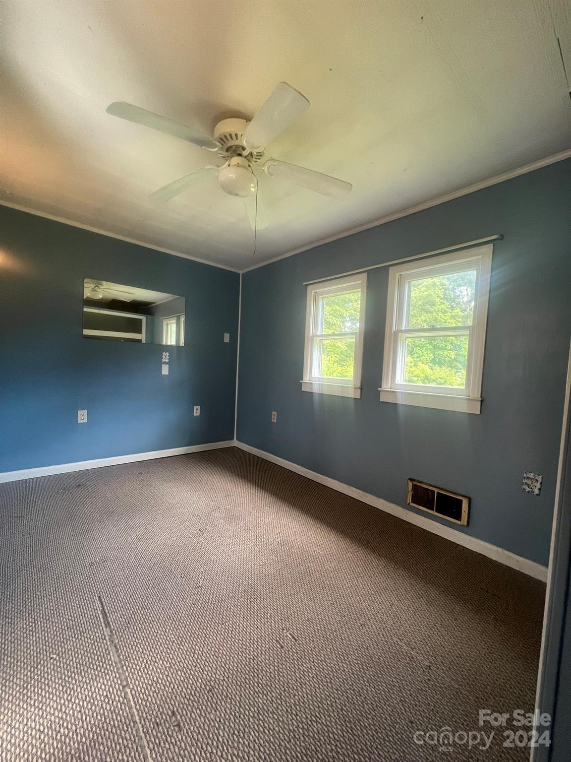 1323 Locust Grove Road Hendersonville, NC 28792 - Photo 24 of 40 a view of an empty room with a window