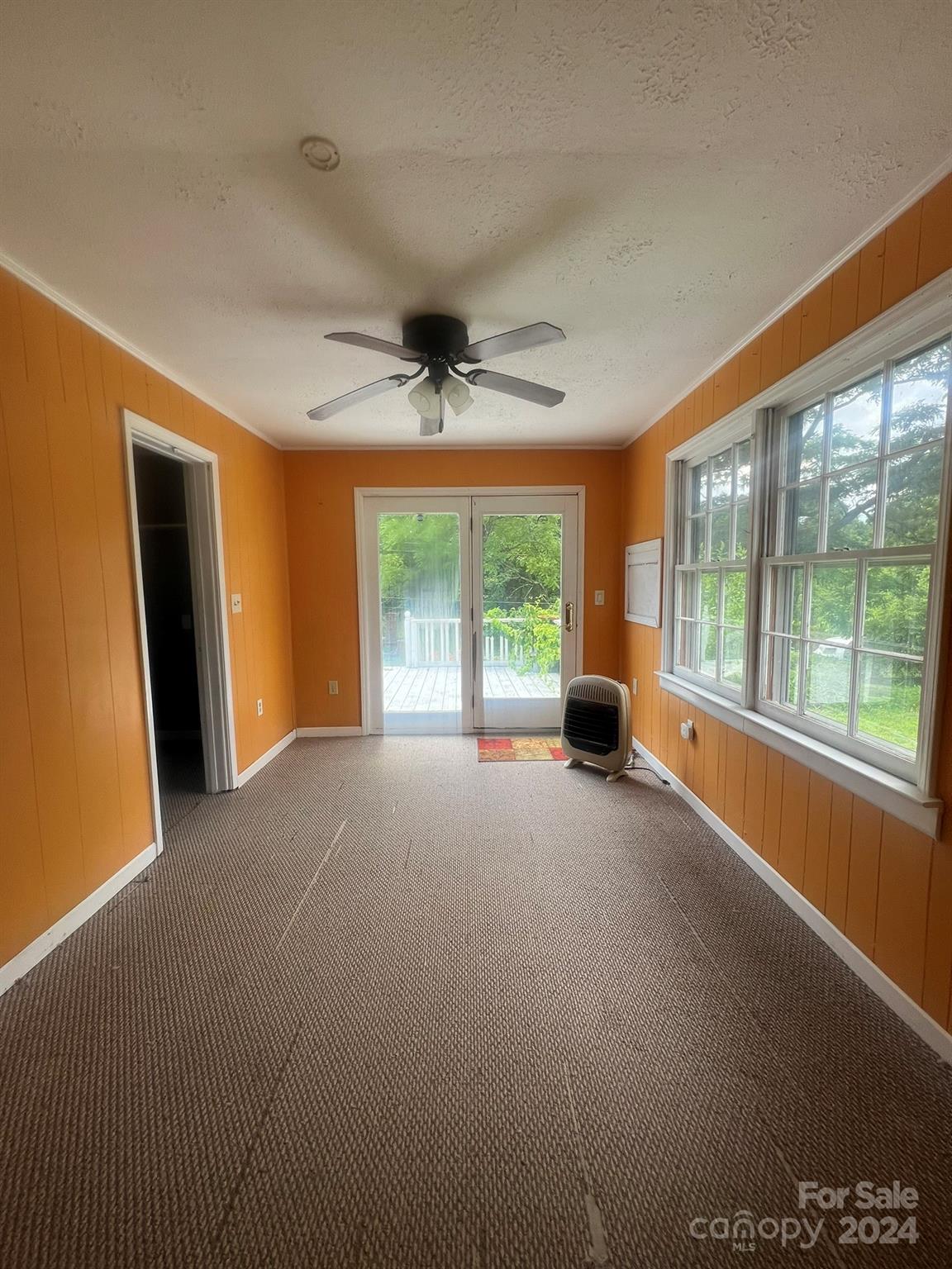 1323 Locust Grove Road Hendersonville, NC 28792 - Photo 27 of 40 a view of an empty room with a window