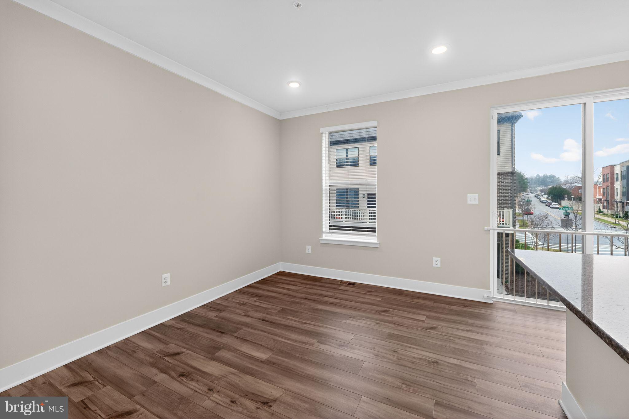4300 Roland Heights Avenue Baltimore, MD 21211 - Photo 20 of 37 wooden floor in an empty room with a window