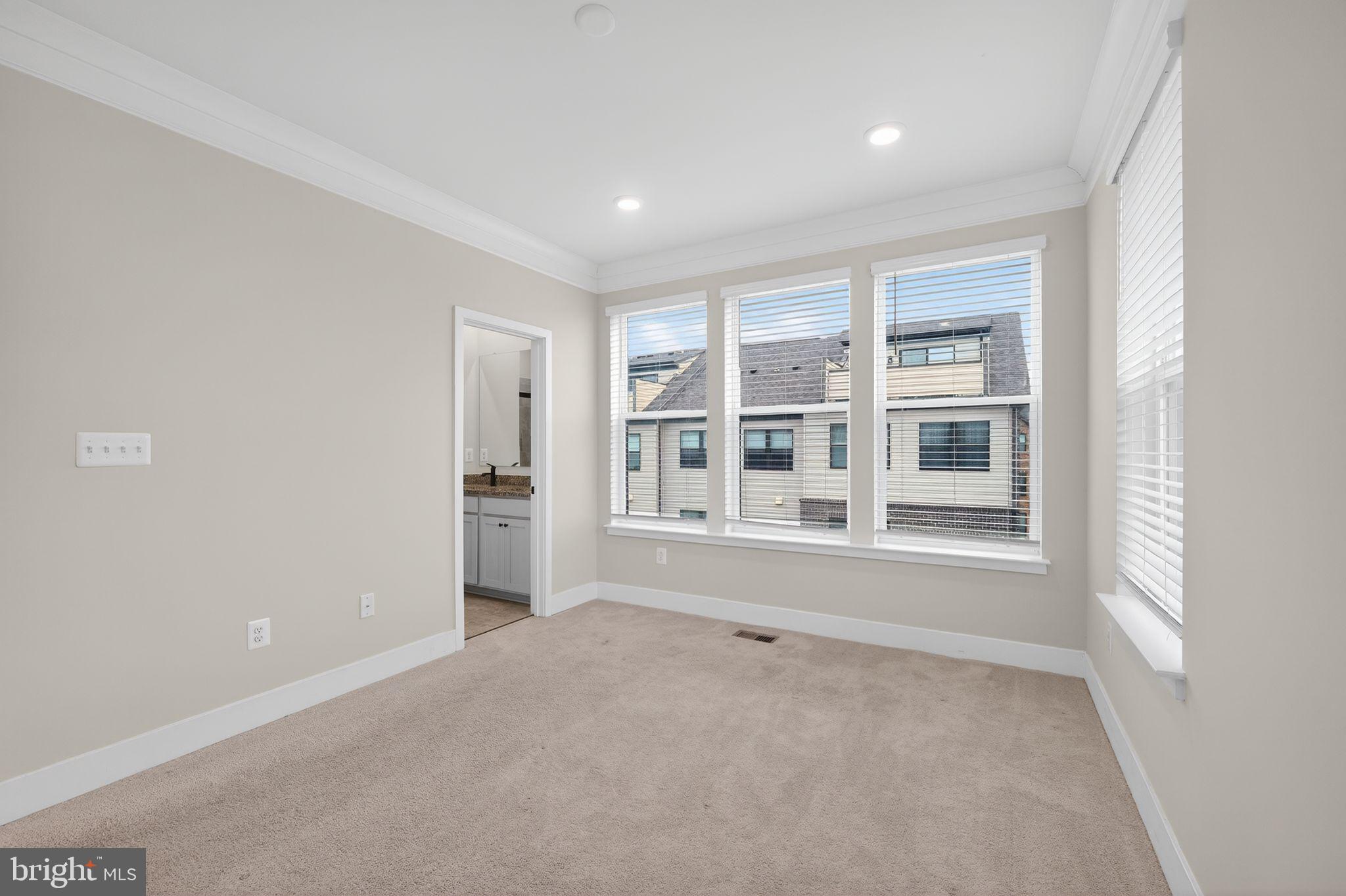 4300 Roland Heights Avenue Baltimore, MD 21211 - Photo 27 of 37 a view of an empty room with a window