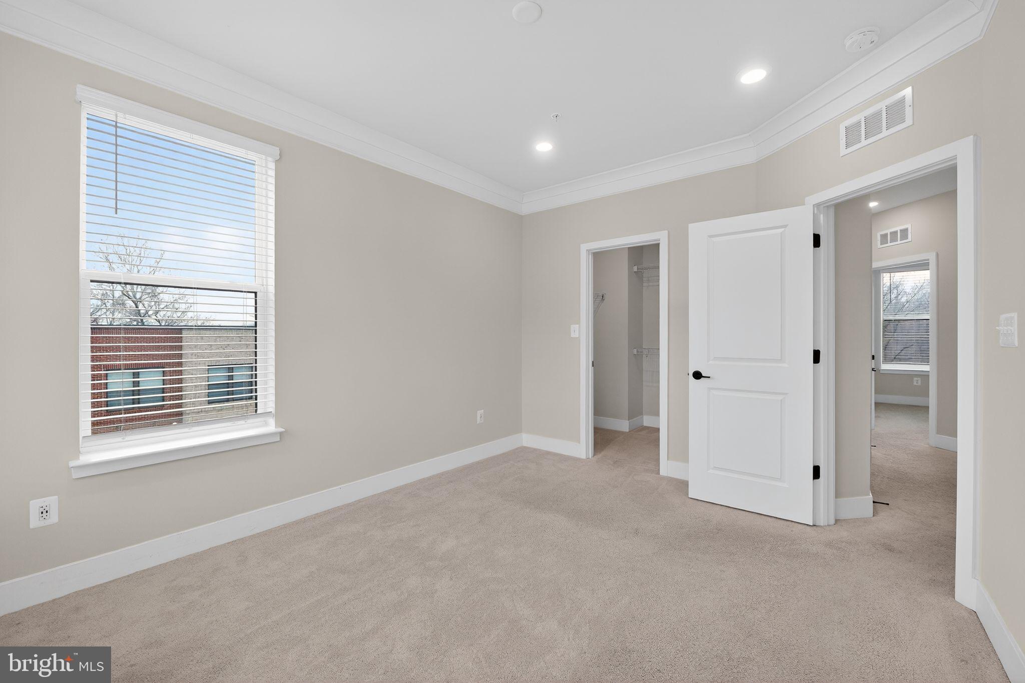 4300 Roland Heights Avenue Baltimore, MD 21211 - Photo 29 of 37 a view of an empty room with a window