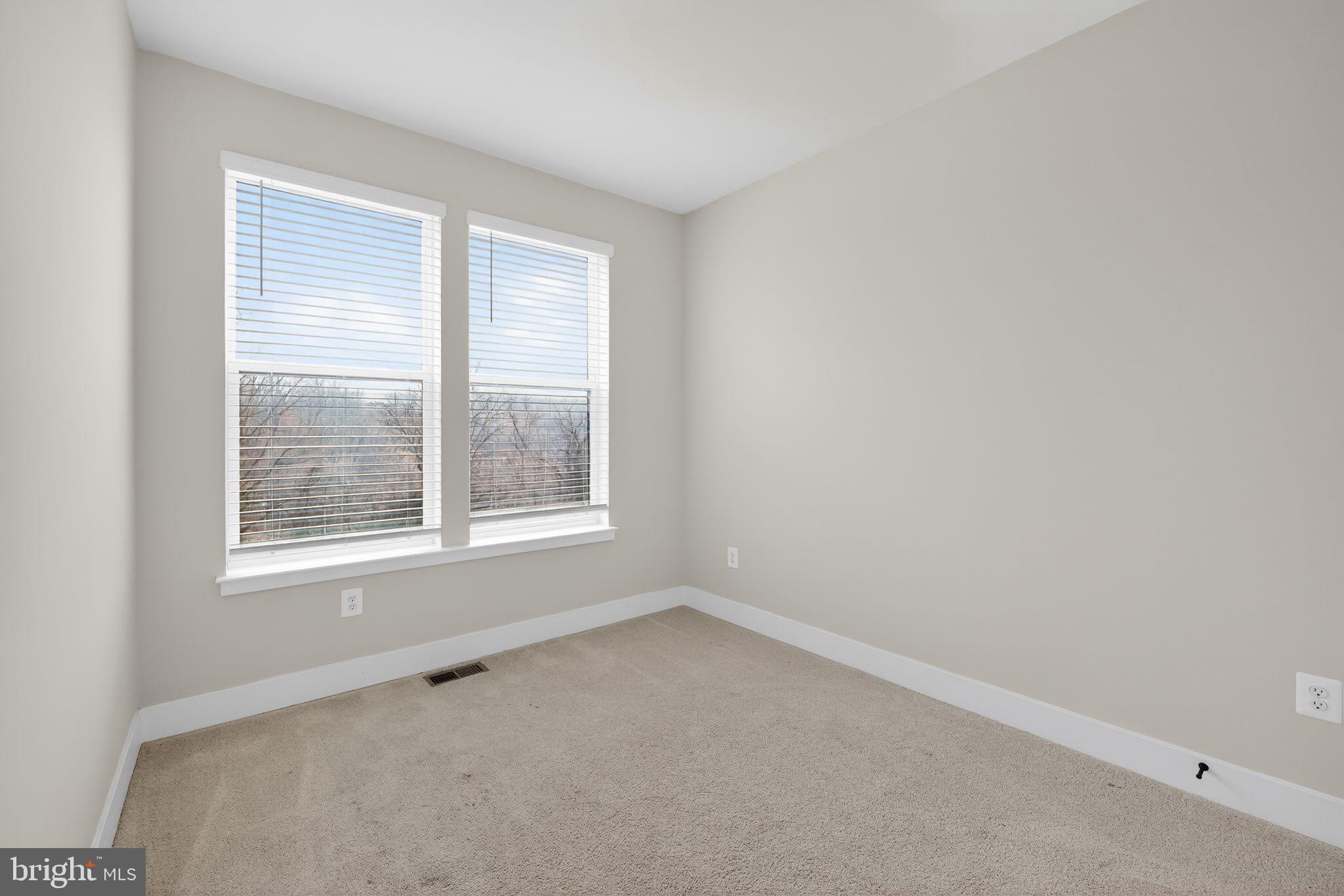 4300 Roland Heights Avenue Baltimore, MD 21211 - Photo 32 of 37 an empty room with a window