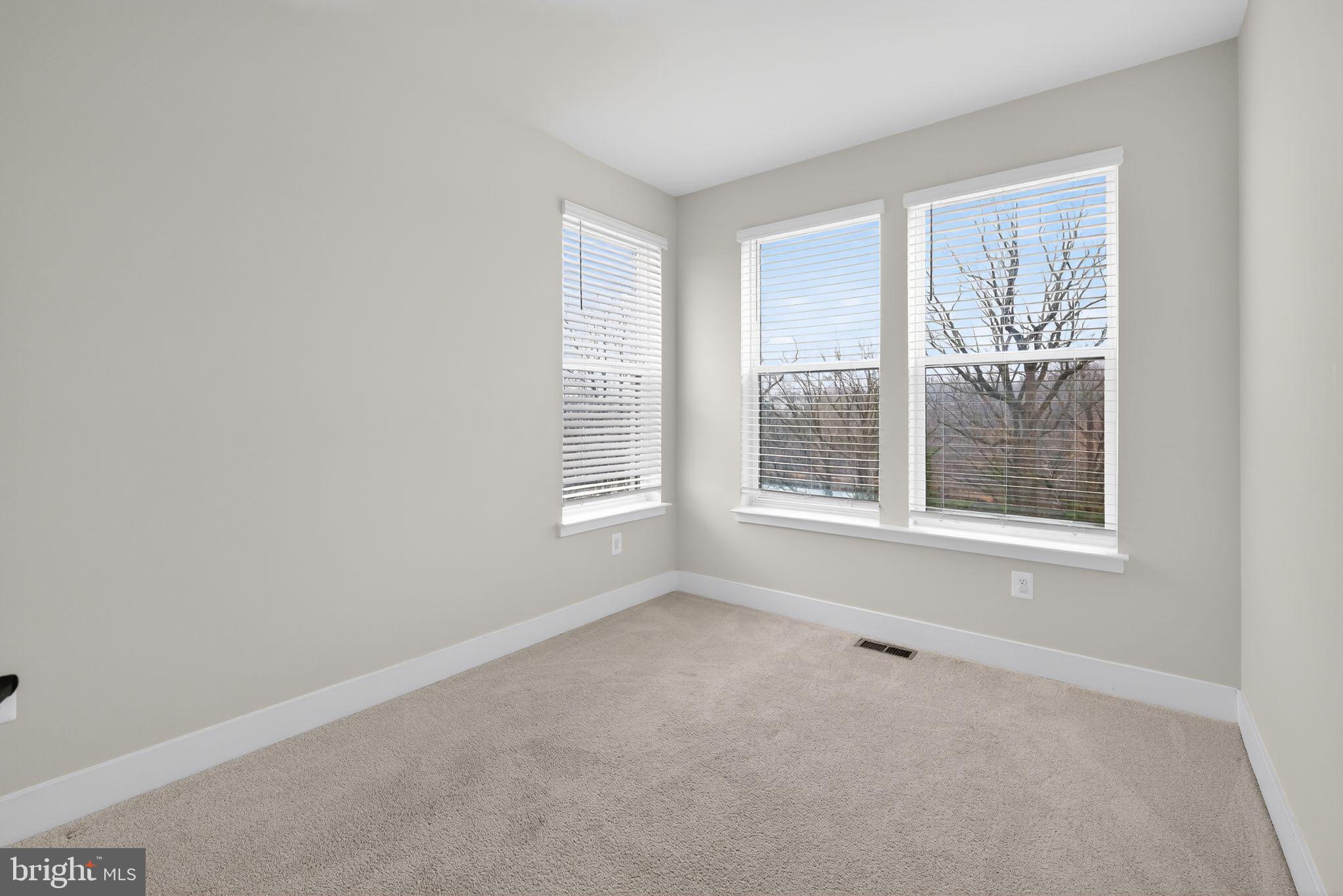 4300 Roland Heights Avenue Baltimore, MD 21211 - Photo 35 of 37 a view of an empty room with a window