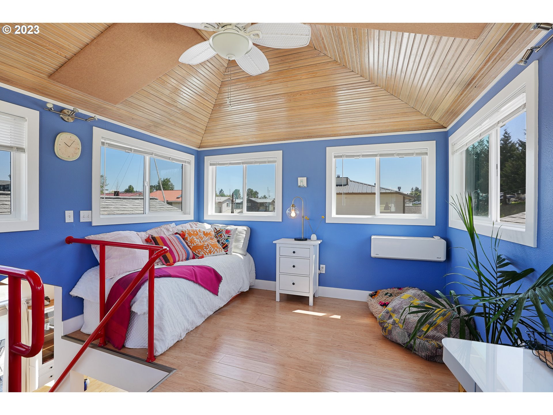 205 North Bridgeton Road, Unit 6 Portland, OR 97217 - Photo 18 of 22 a bedroom with a bed and dresser with mirror
