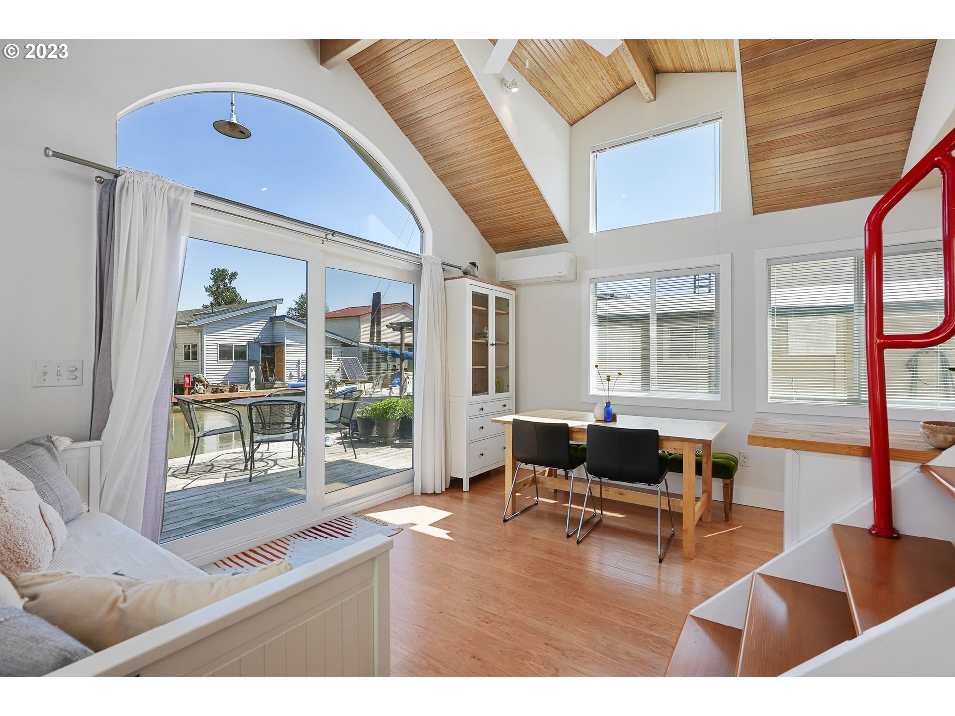 205 North Bridgeton Road, Unit 6 Portland, OR 97217 - Photo 9 of 22 a living room with furniture and a floor to ceiling window