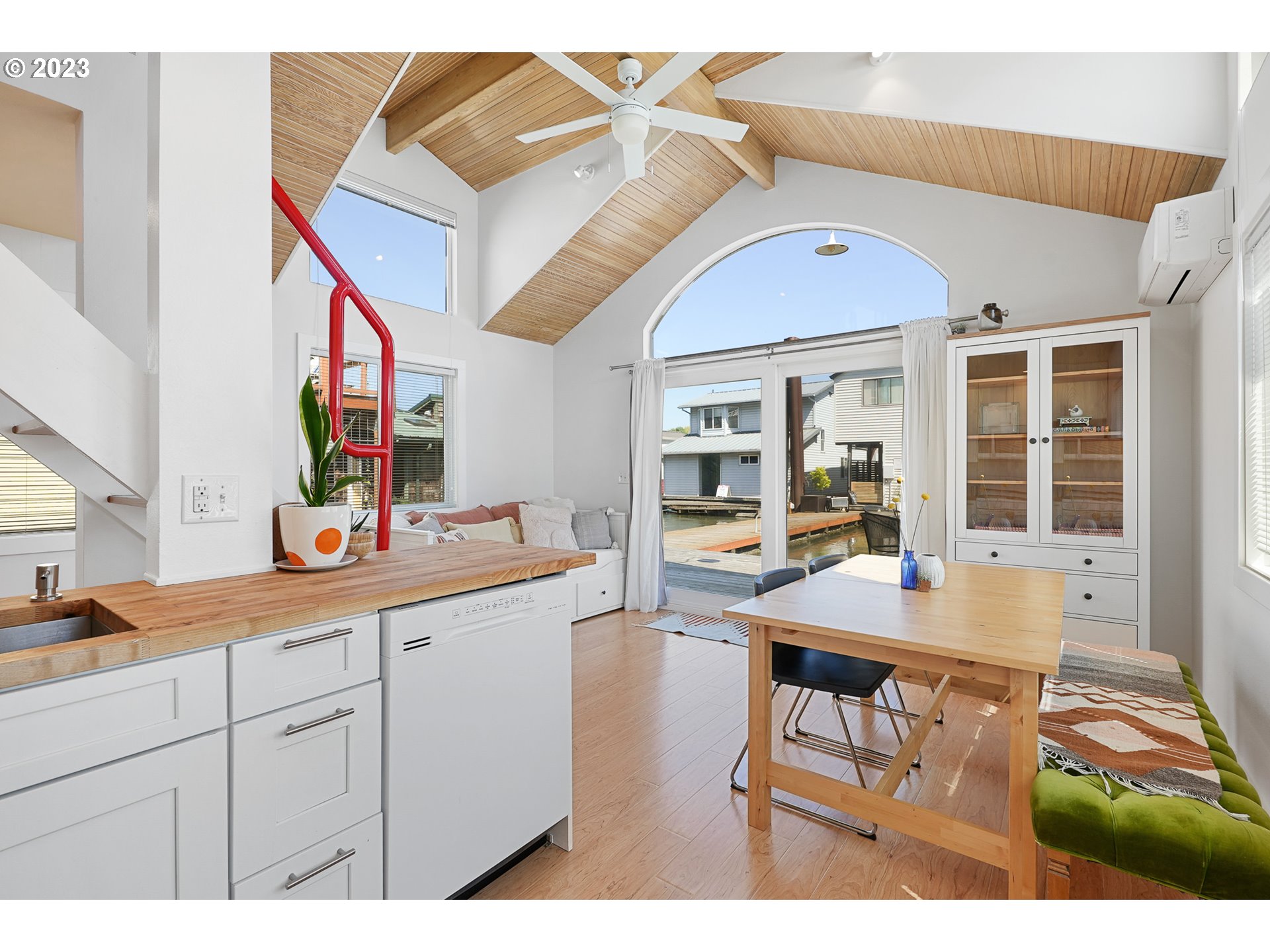 205 North Bridgeton Road, Unit 6 Portland, OR 97217 - Photo 10 of 22 a dining hall with stainless steel appliances kitchen island granite countertop a dining table and chairs with wooden floor