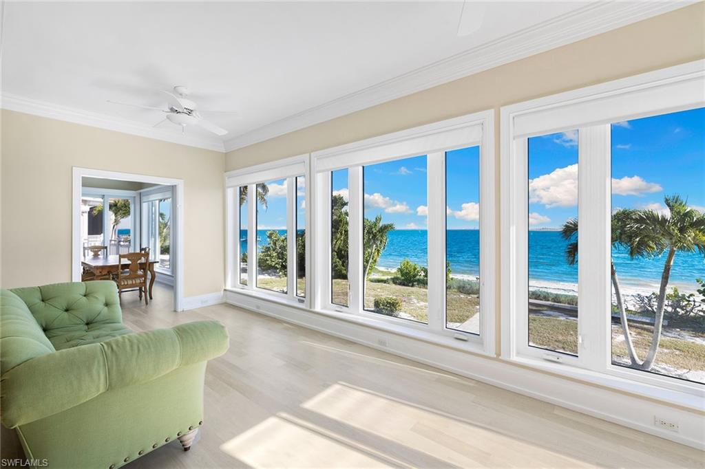 1069 Bird Lane Sanibel, FL 33957 - Photo 14 of 46 a living room with furniture and a large window