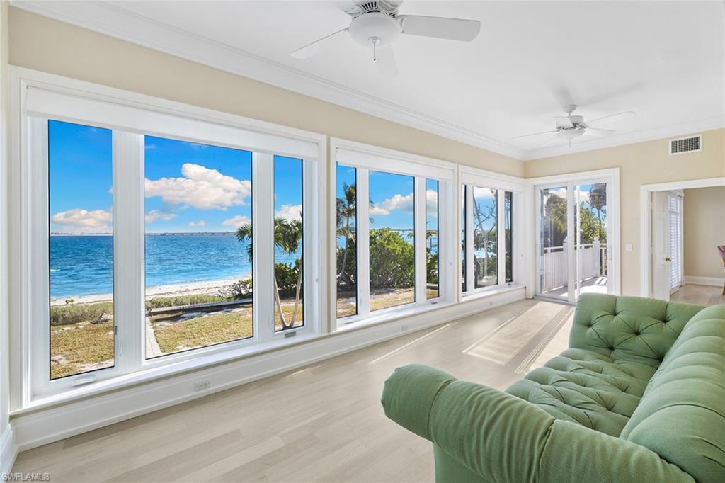 1069 Bird Lane Sanibel, FL 33957 - Photo 15 of 46 a living room with furniture and a large window