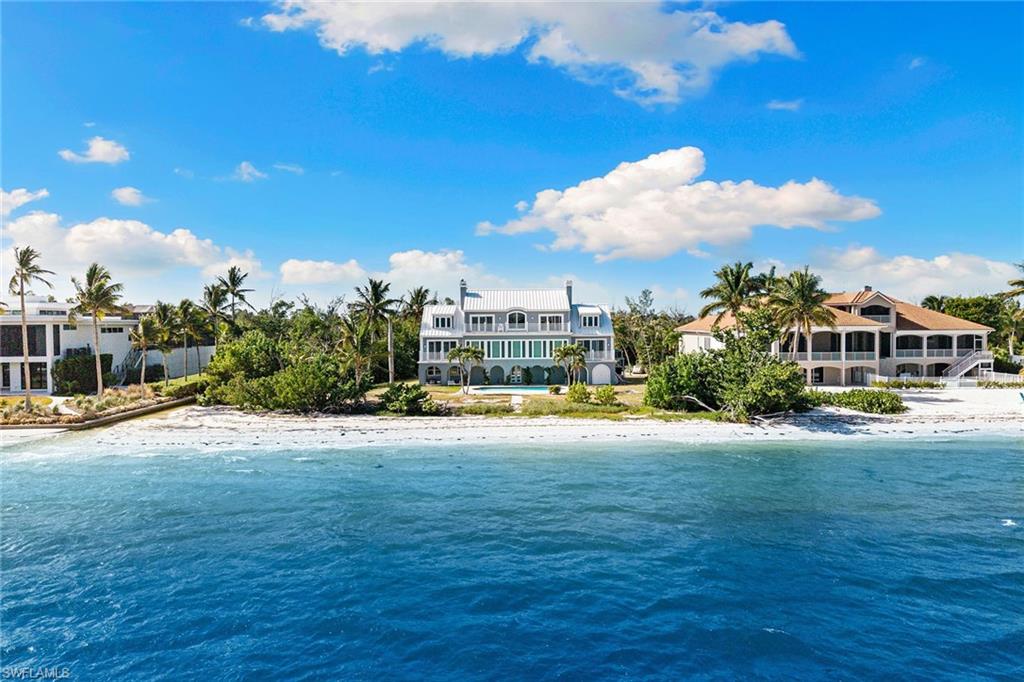 1069 Bird Lane Sanibel, FL 33957 - Photo 2 of 46 a view of a house with a yard