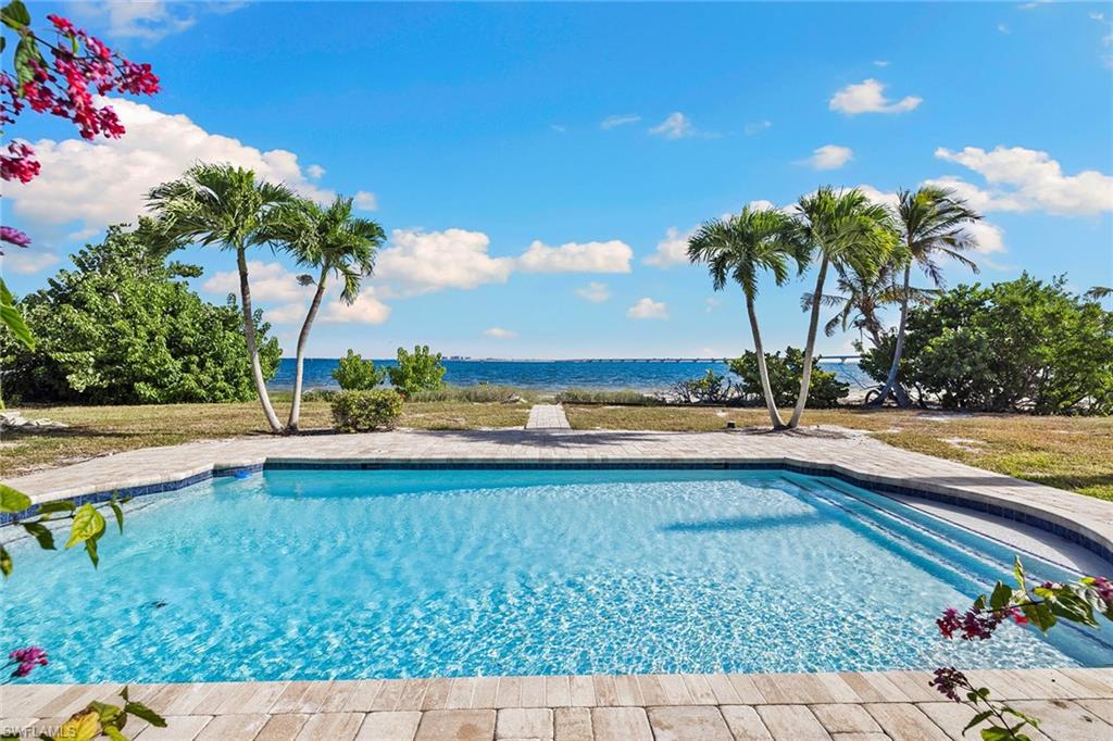 1069 Bird Lane Sanibel, FL 33957 - Photo 28 of 46 a view of swimming pool with outdoor seating and yard