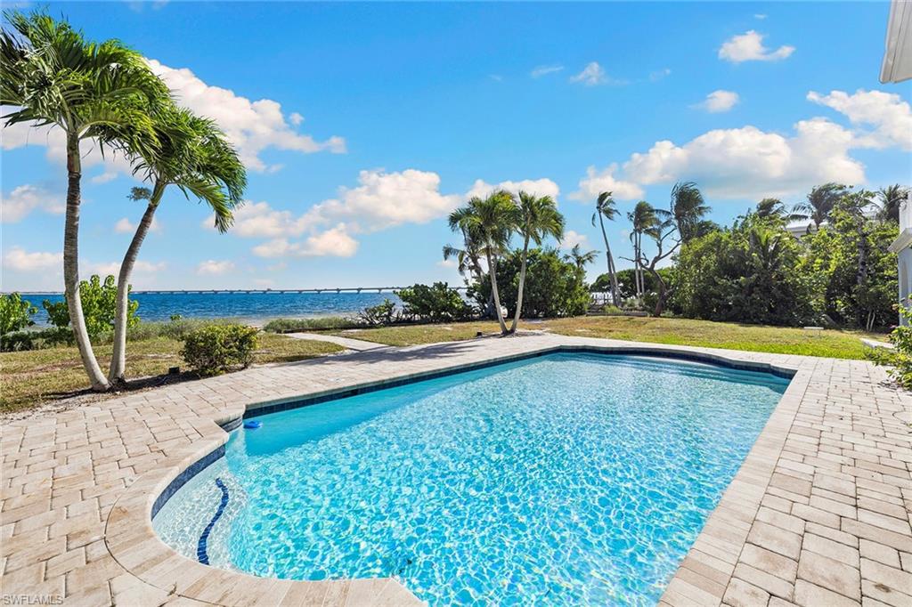 1069 Bird Lane Sanibel, FL 33957 - Photo 30 of 46 a view of a swimming pool and an outdoor space