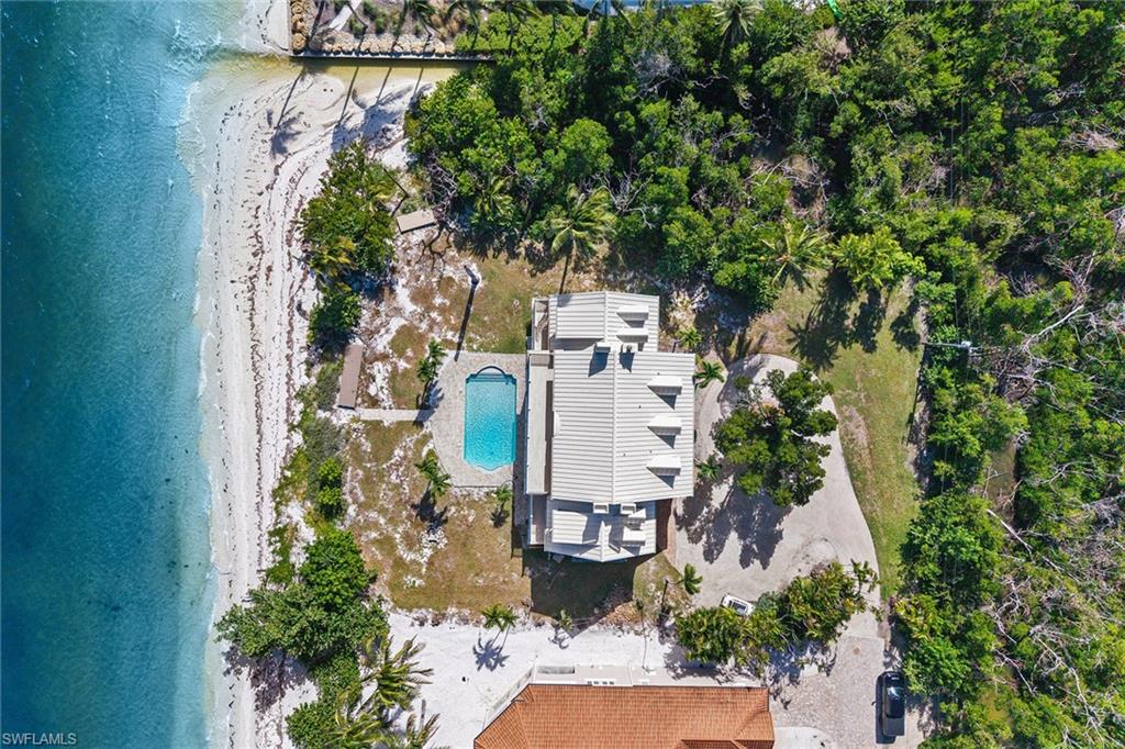 1069 Bird Lane Sanibel, FL 33957 - Photo 42 of 46 an aerial view of a house with outdoor space