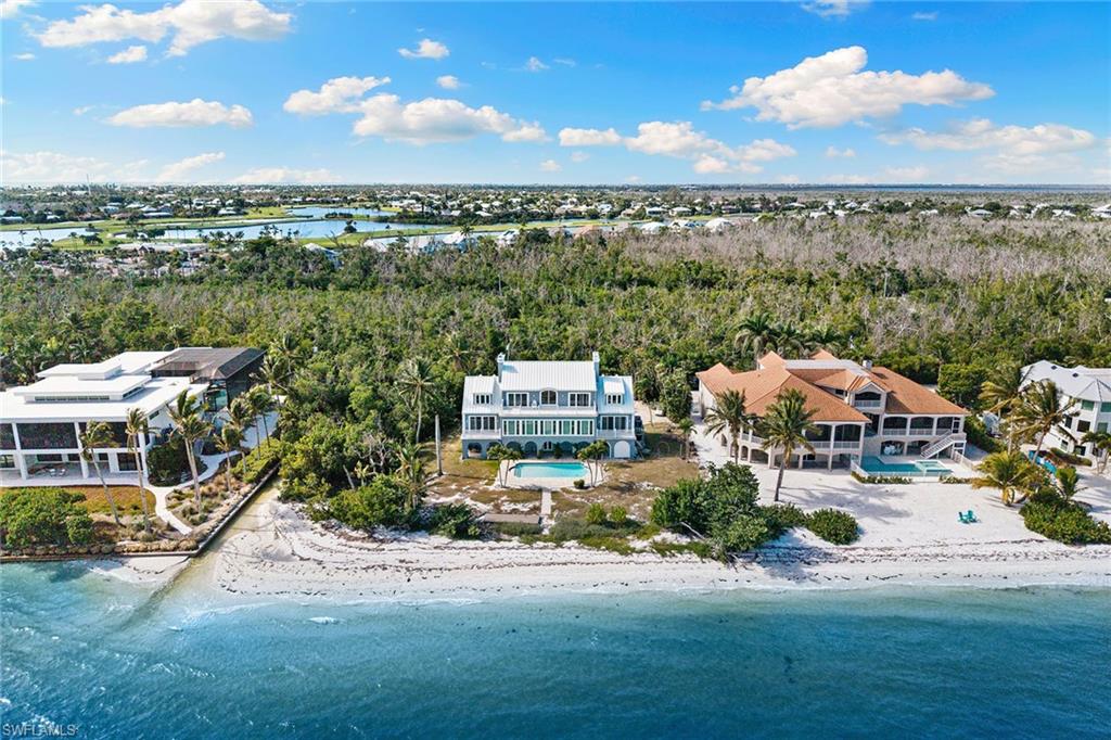1069 Bird Lane Sanibel, FL 33957 - Photo 46 of 46 an aerial view of multiple houses with a yard