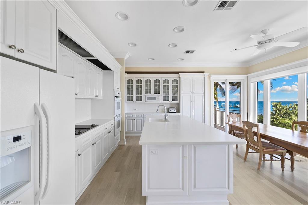 1069 Bird Lane Sanibel, FL 33957 - Photo 7 of 46 a very nice looking dining room with a large window