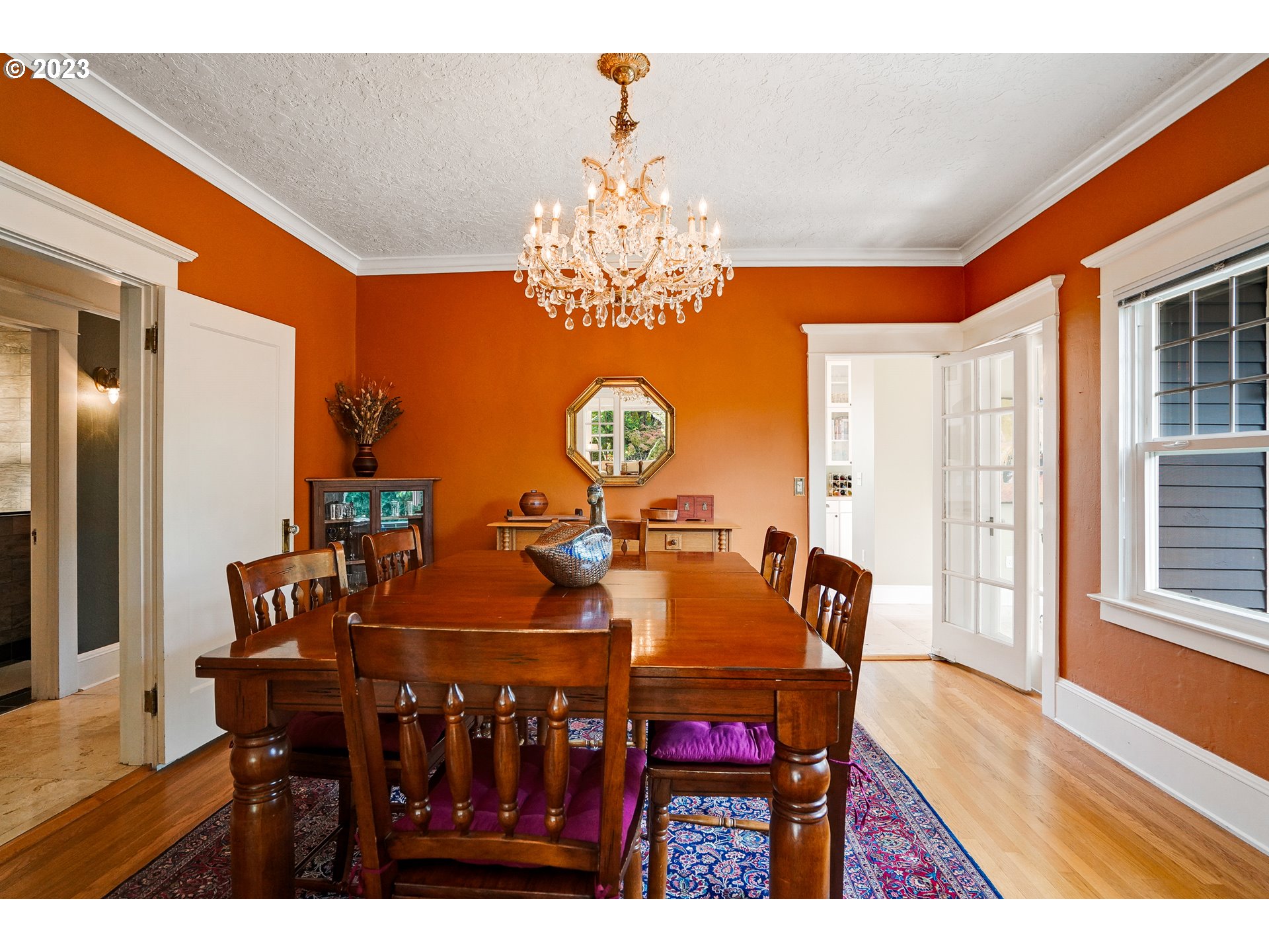 810 North Water Street Silverton, OR 97381 - Photo 13 of 48 a view of a dining room with furniture and chandelier