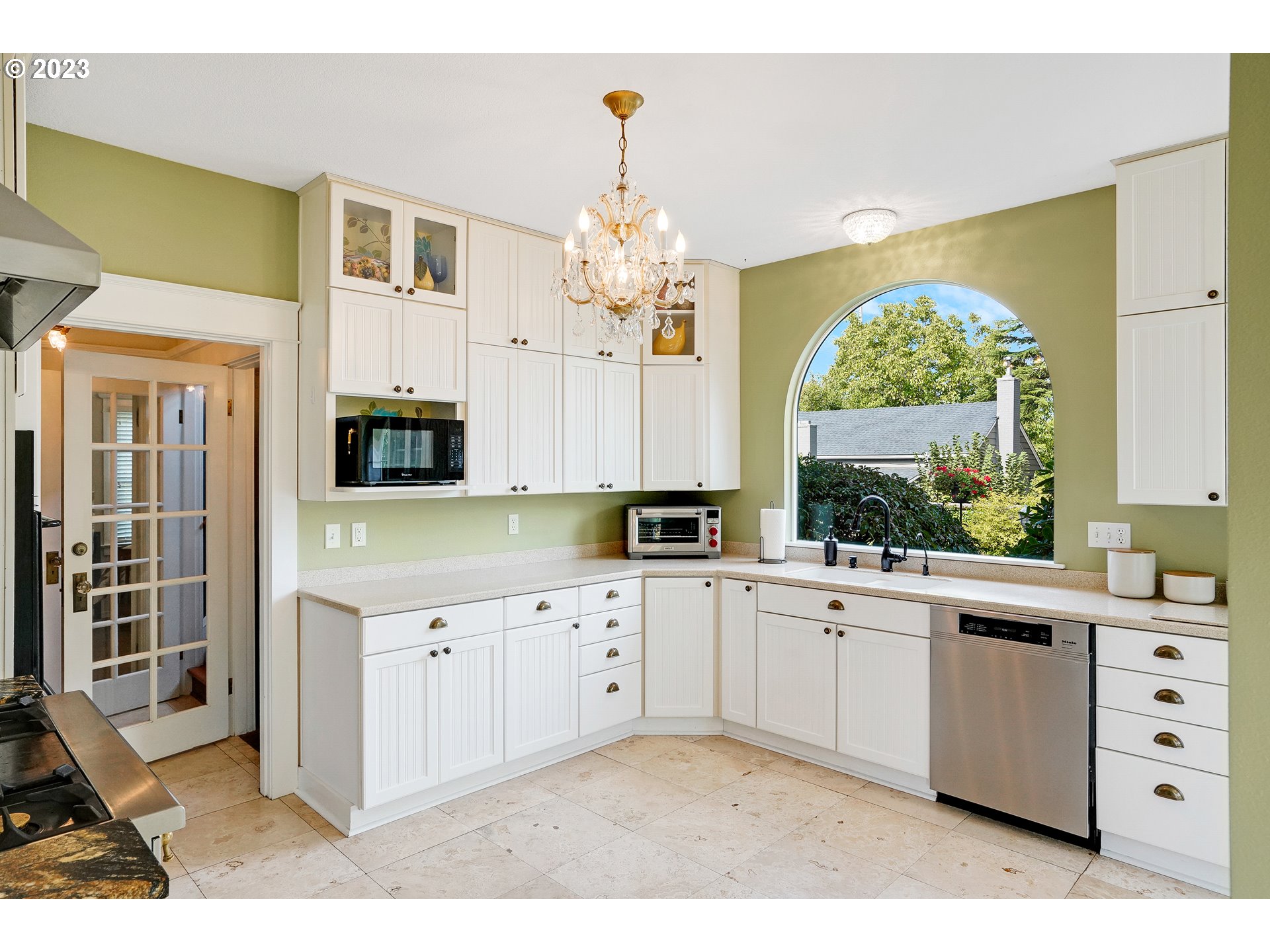 810 North Water Street Silverton, OR 97381 - Photo 15 of 48 a kitchen with a sink window and cabinets