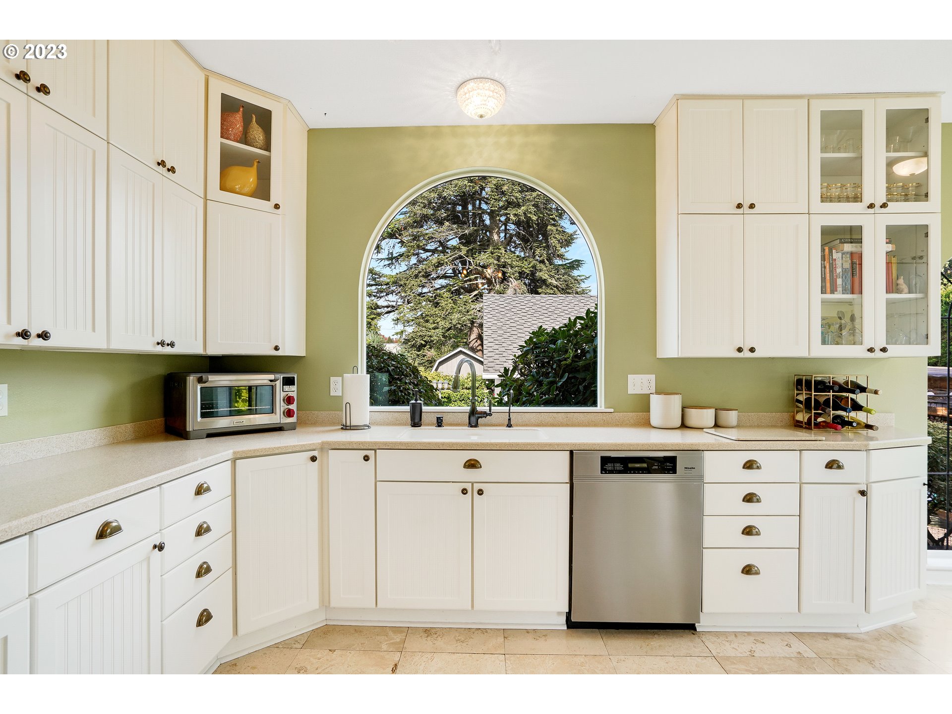 810 North Water Street Silverton, OR 97381 - Photo 16 of 48 a kitchen with stainless steel appliances a white cabinets and a window