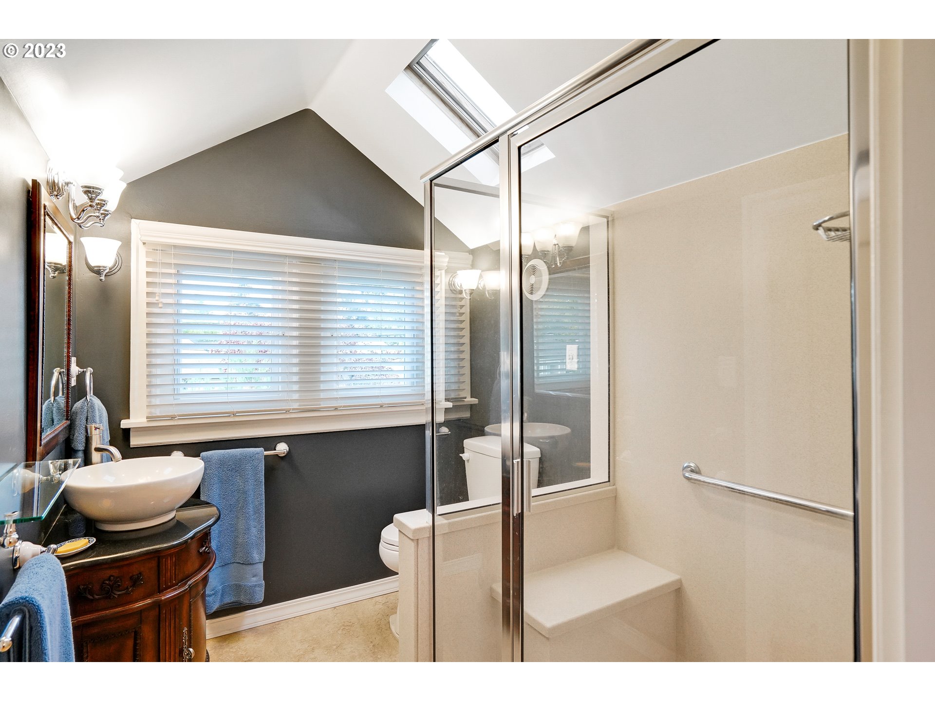 810 North Water Street Silverton, OR 97381 - Photo 29 of 48 a bathroom with a sink a toilet and a mirror