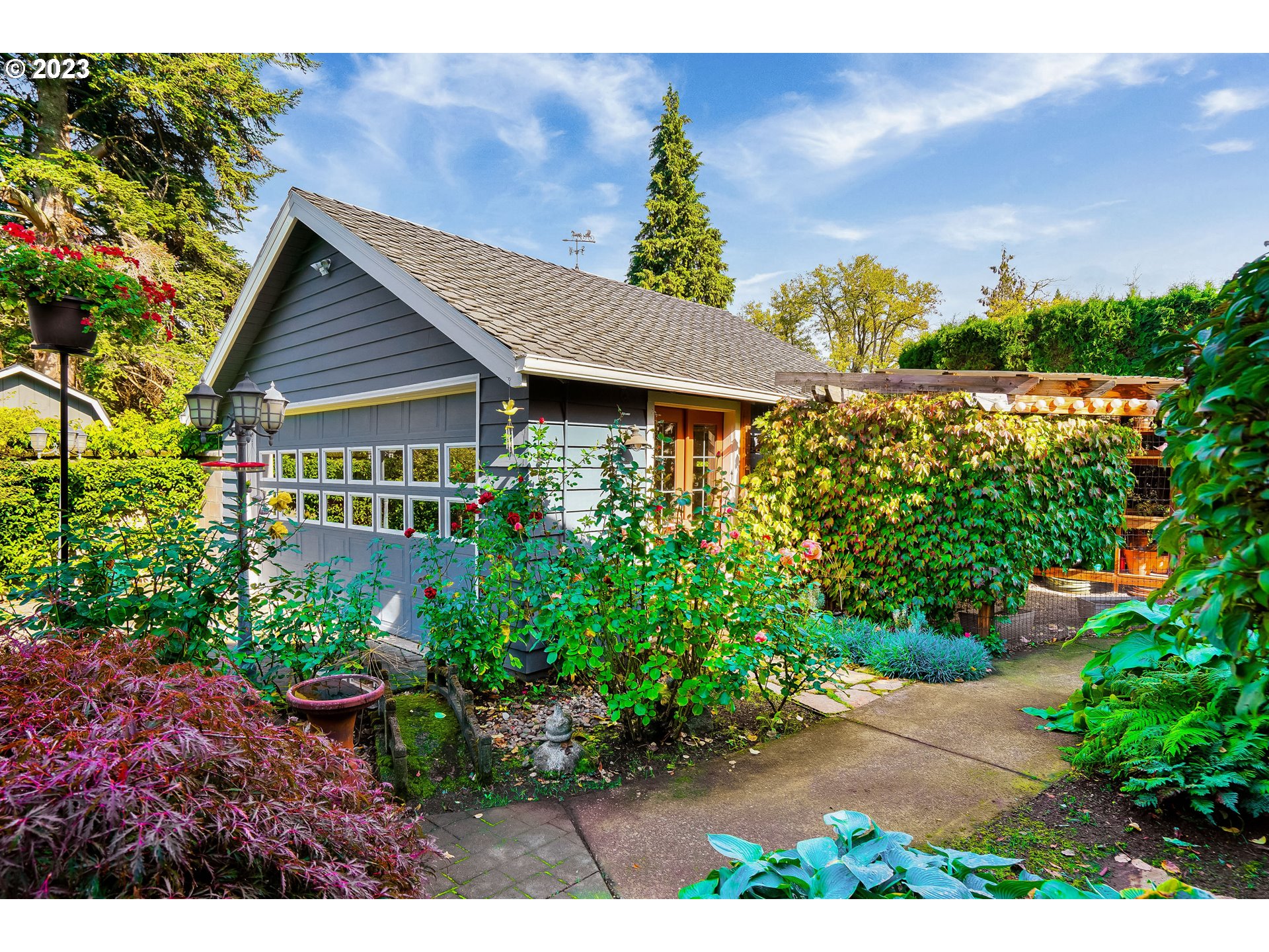 810 North Water Street Silverton, OR 97381 - Photo 40 of 48 a view of a house with a yard and garden