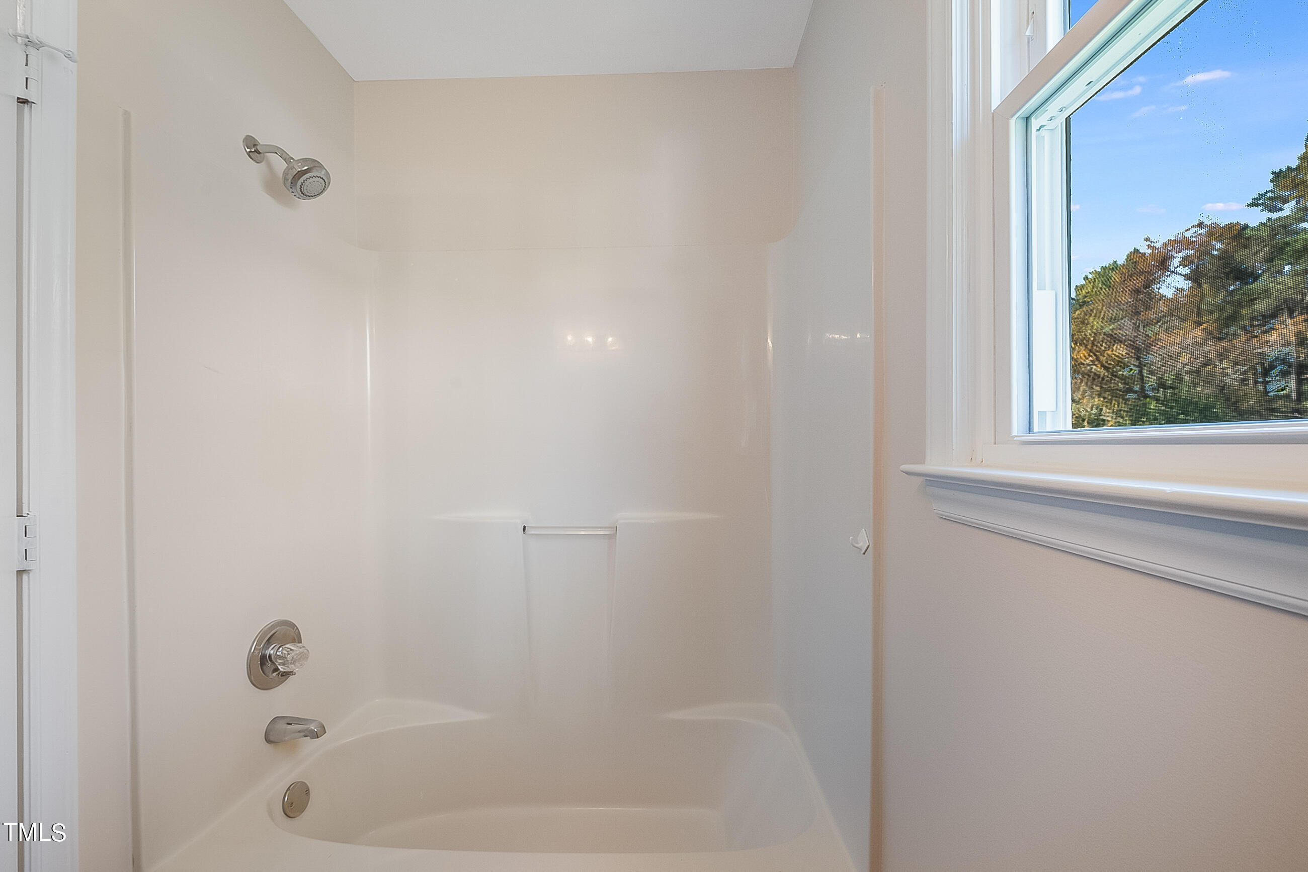 10024 Joe Leach Road Raleigh, NC 27603 - Photo 14 of 26 a close up of a bathtub curtain