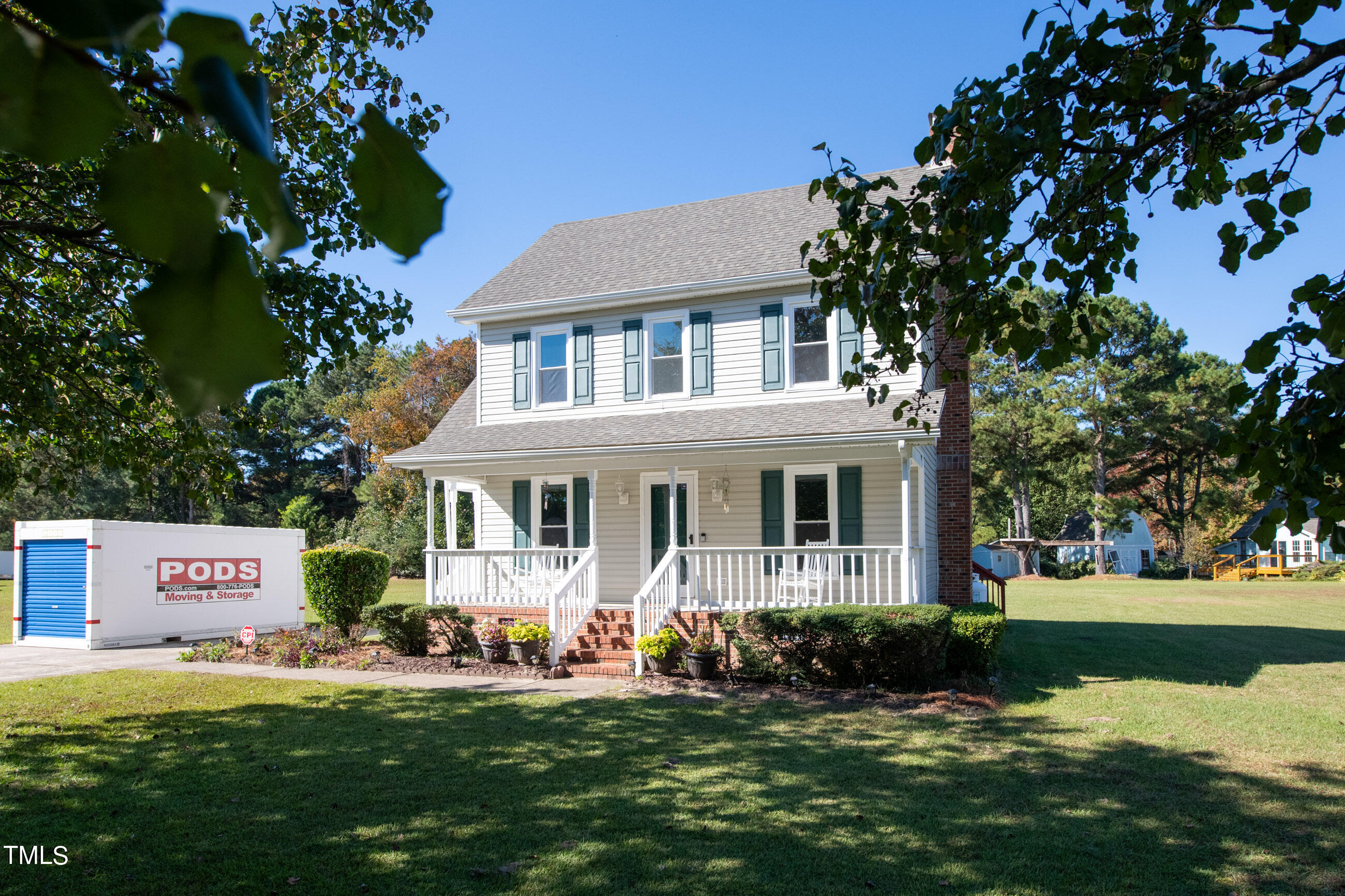 10024 Joe Leach Road Raleigh, NC 27603 - Photo 2 of 26 a front view of a house with garden and porch