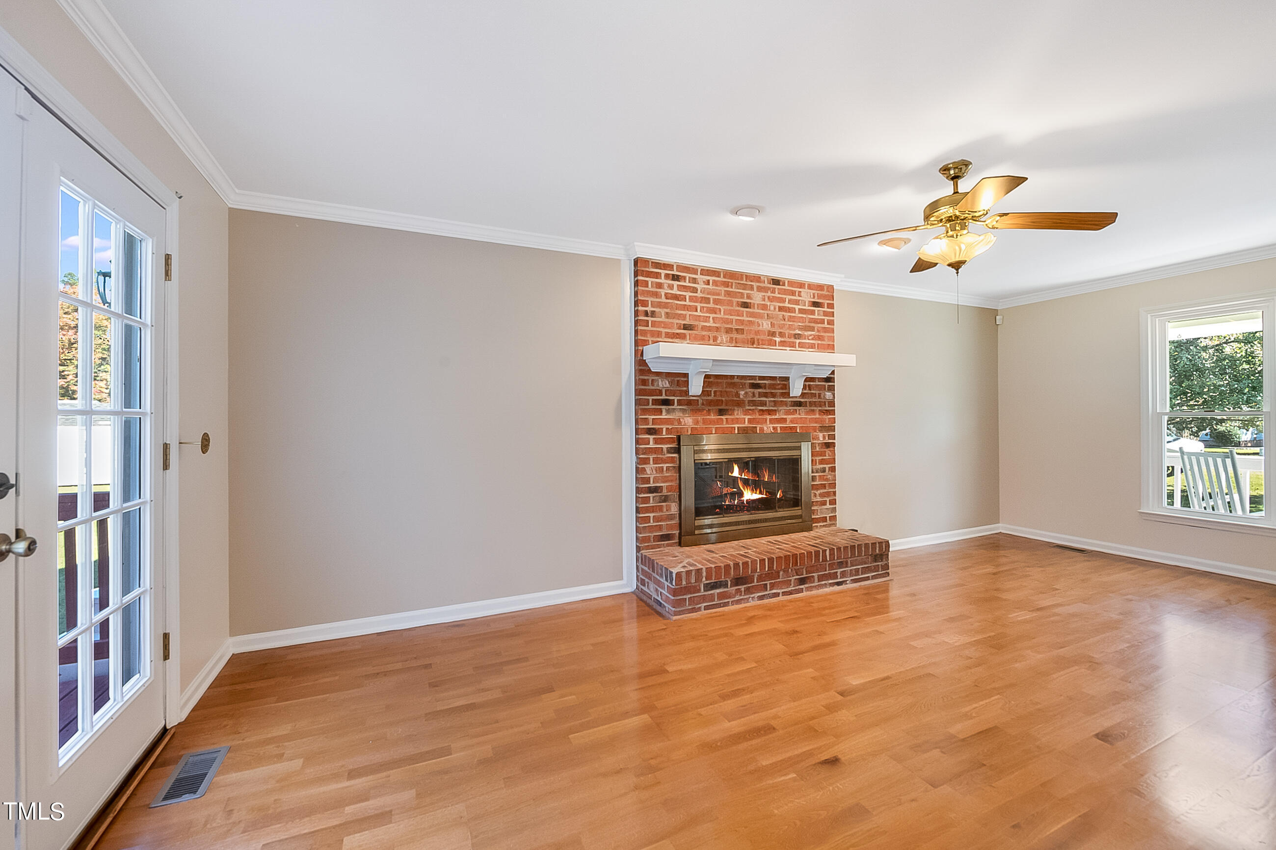 10024 Joe Leach Road Raleigh, NC 27603 - Photo 23 of 26 wooden floor in an empty room with a window