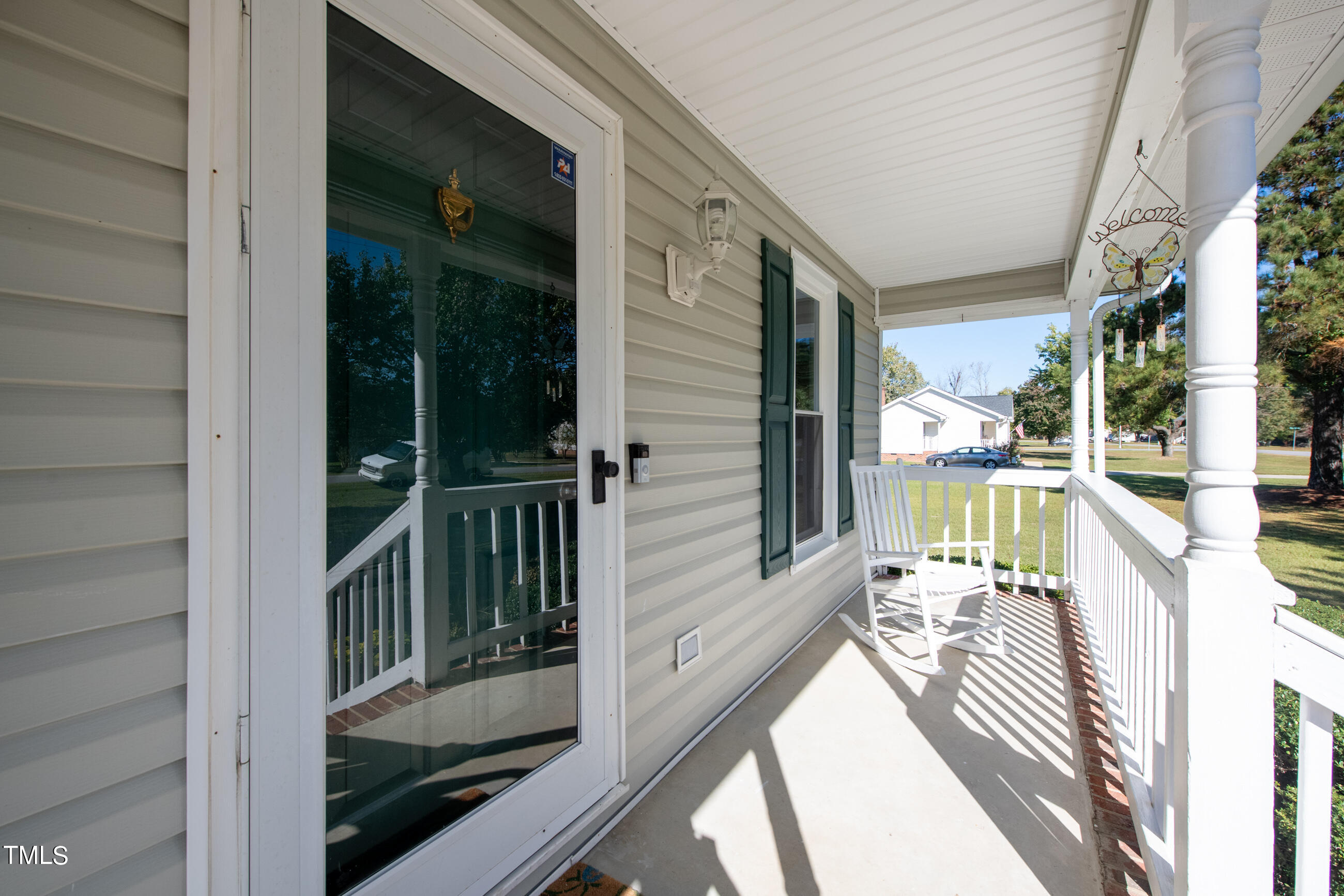 10024 Joe Leach Road Raleigh, NC 27603 - Photo 3 of 26 a view of balcony with floor to ceiling windows and wooden floor