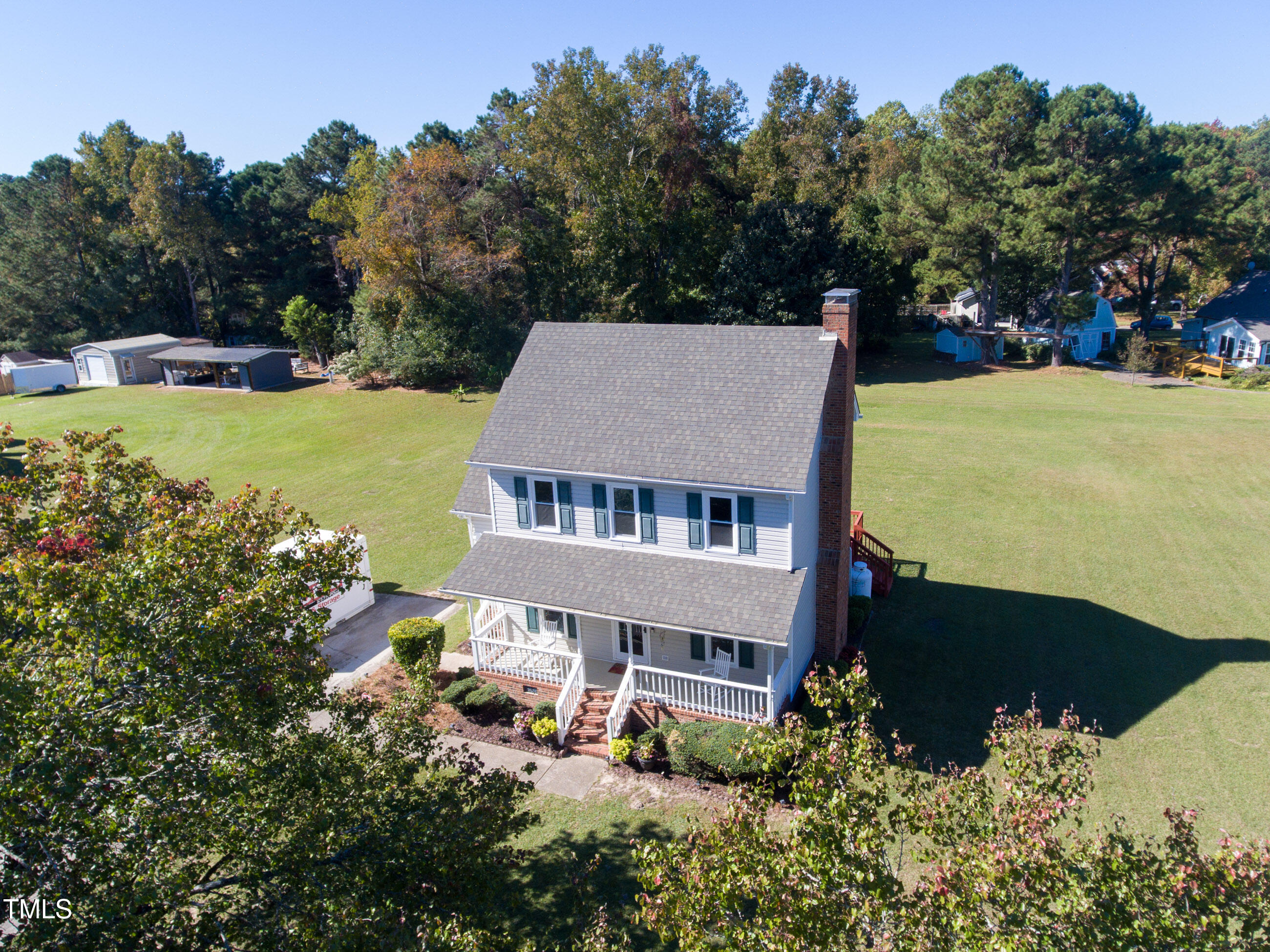 10024 Joe Leach Road Raleigh, NC 27603 - Photo 6 of 26 an aerial view of a house with garden space and trees all around