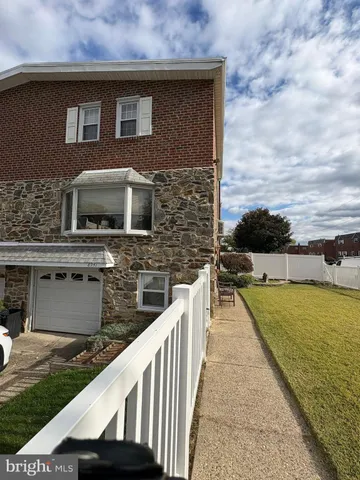 a view of a brick house with a ocean view